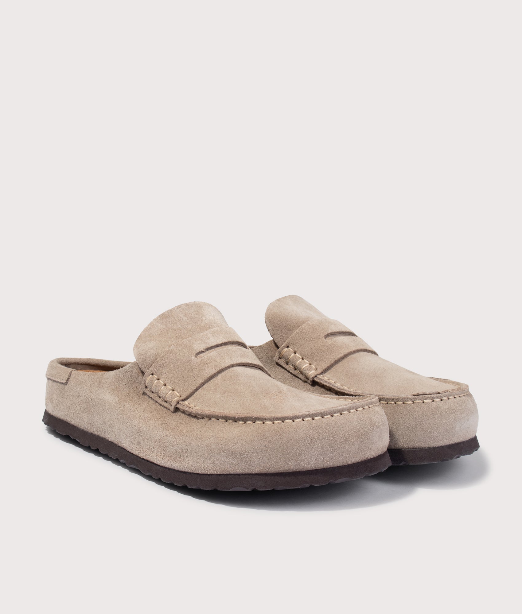 Naples Wrapped Suede Leather Clogs in Taupe by BIRKENSTOCK. Shot by EQVVS. Front angled shot.