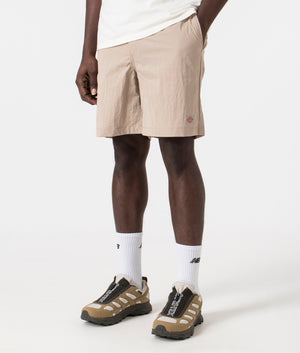 Dickies Fincastle Shorts in Sandstone. Front side angle shot at EQVVS.