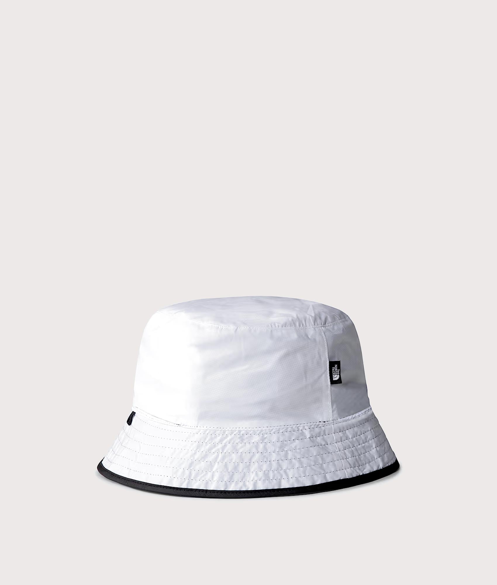 Stash Reversible Bucket Hat in TNF Black/TNF White by The North Face. Shot by EQVVS. Reversible back shot.