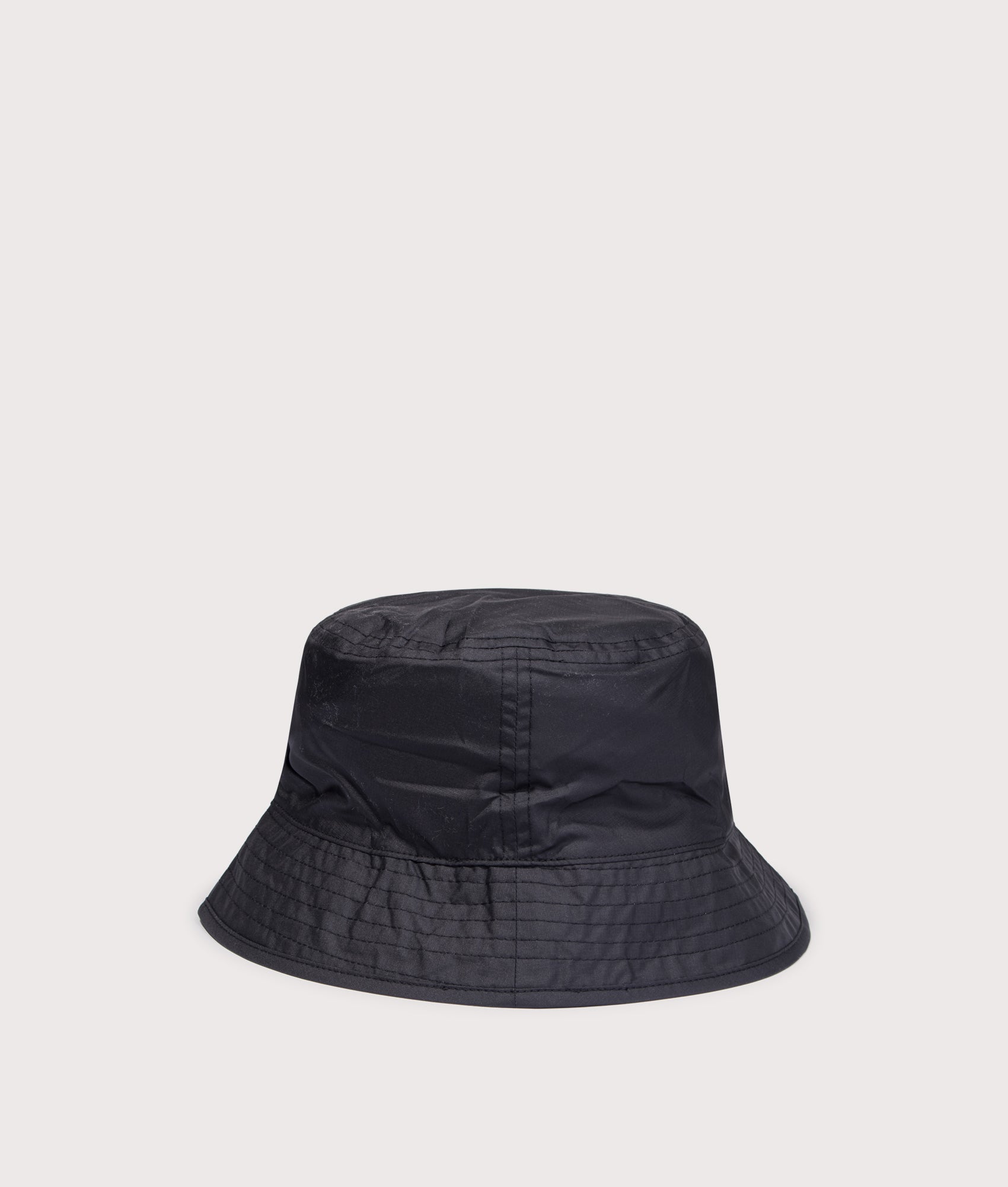 Stash Reversible Bucket Hat in TNF Black/TNF White by The North Face. Shot by EQVVS. Back shot.