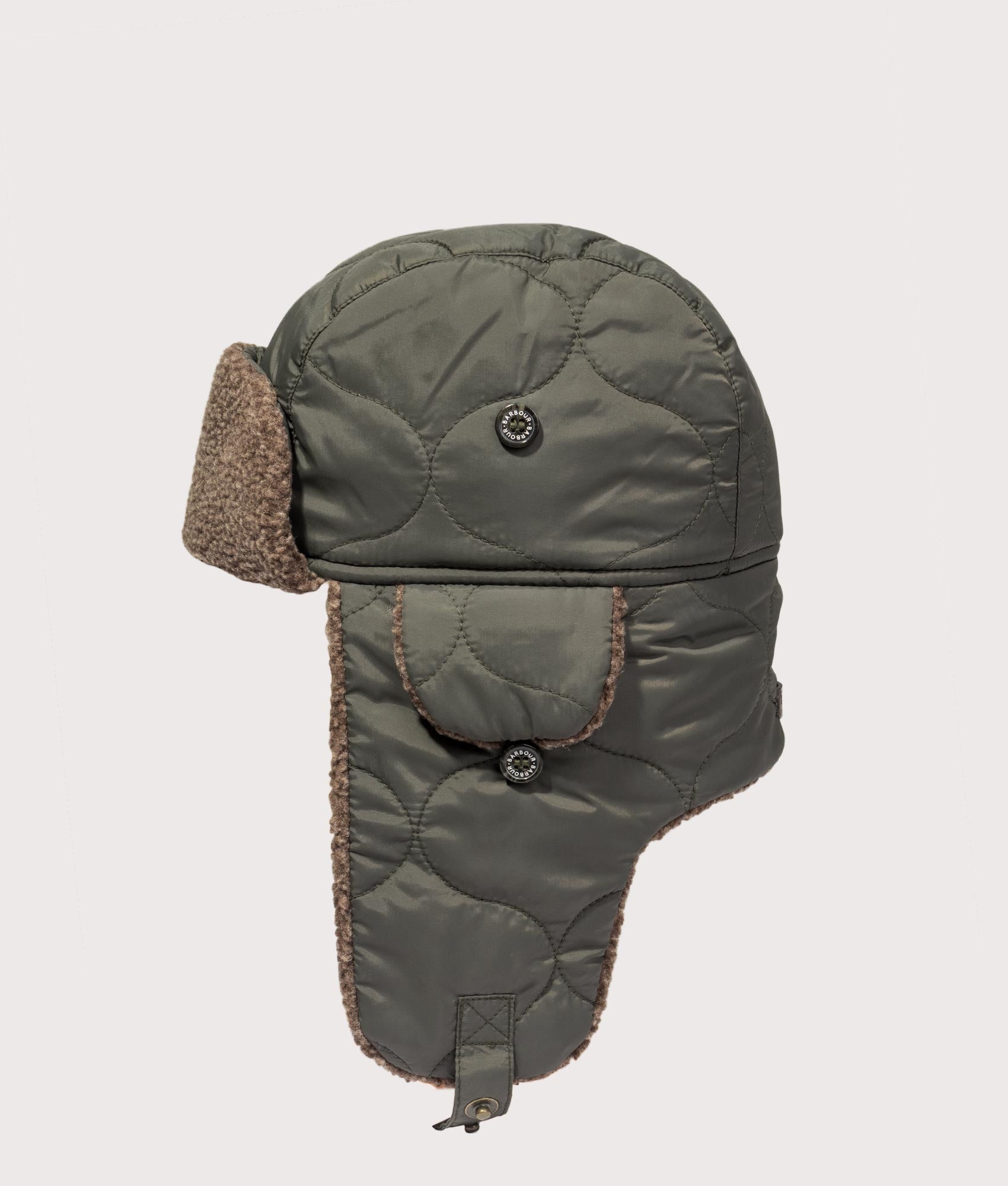 Barbour Sandbay Quilted Trapper Cap in Olive at EQVVS Menswear. Side shot.