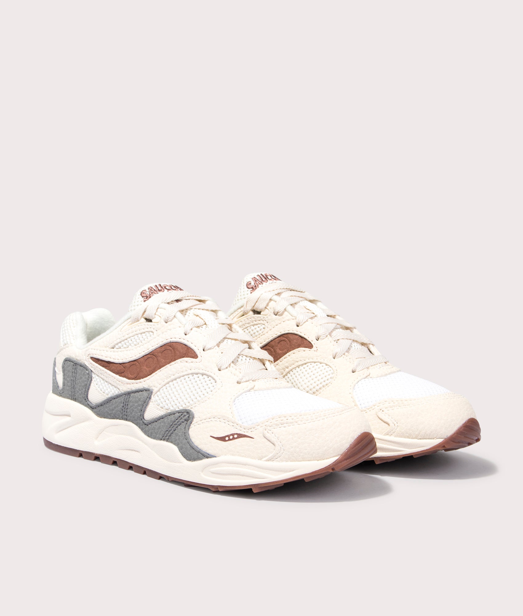 Grid Shadow 2 Sneakers in Sand and Brown by Saucony. EQVVS Front Pair Shot.