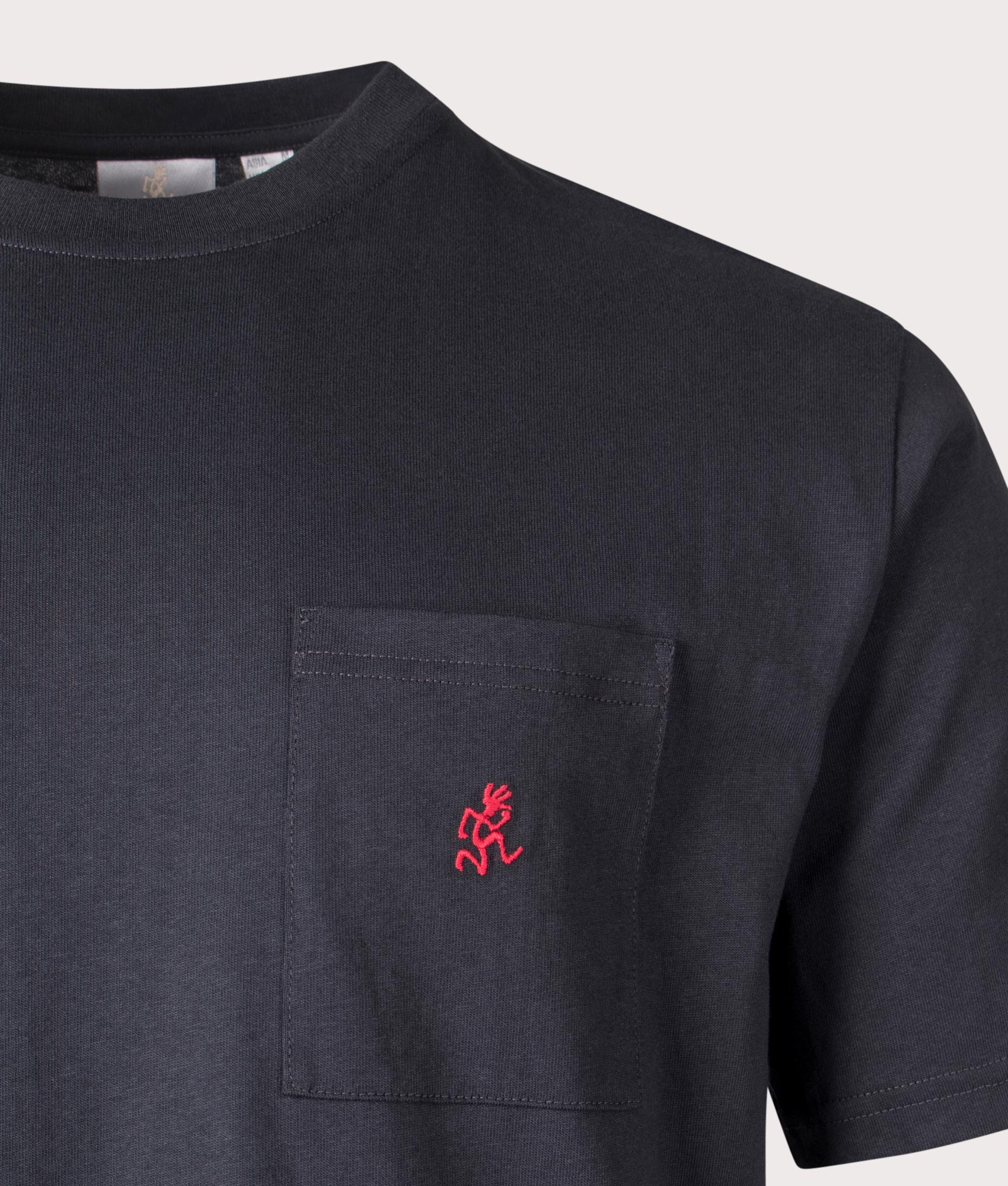 Gramicci One Point tee in vintage black at EQVVS Menswear. Detail shot.