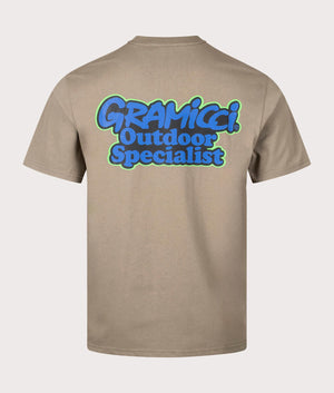 Gramicci Outdoor Specialist T-Shirt in Cayote. Back angle shot at EQVVS.