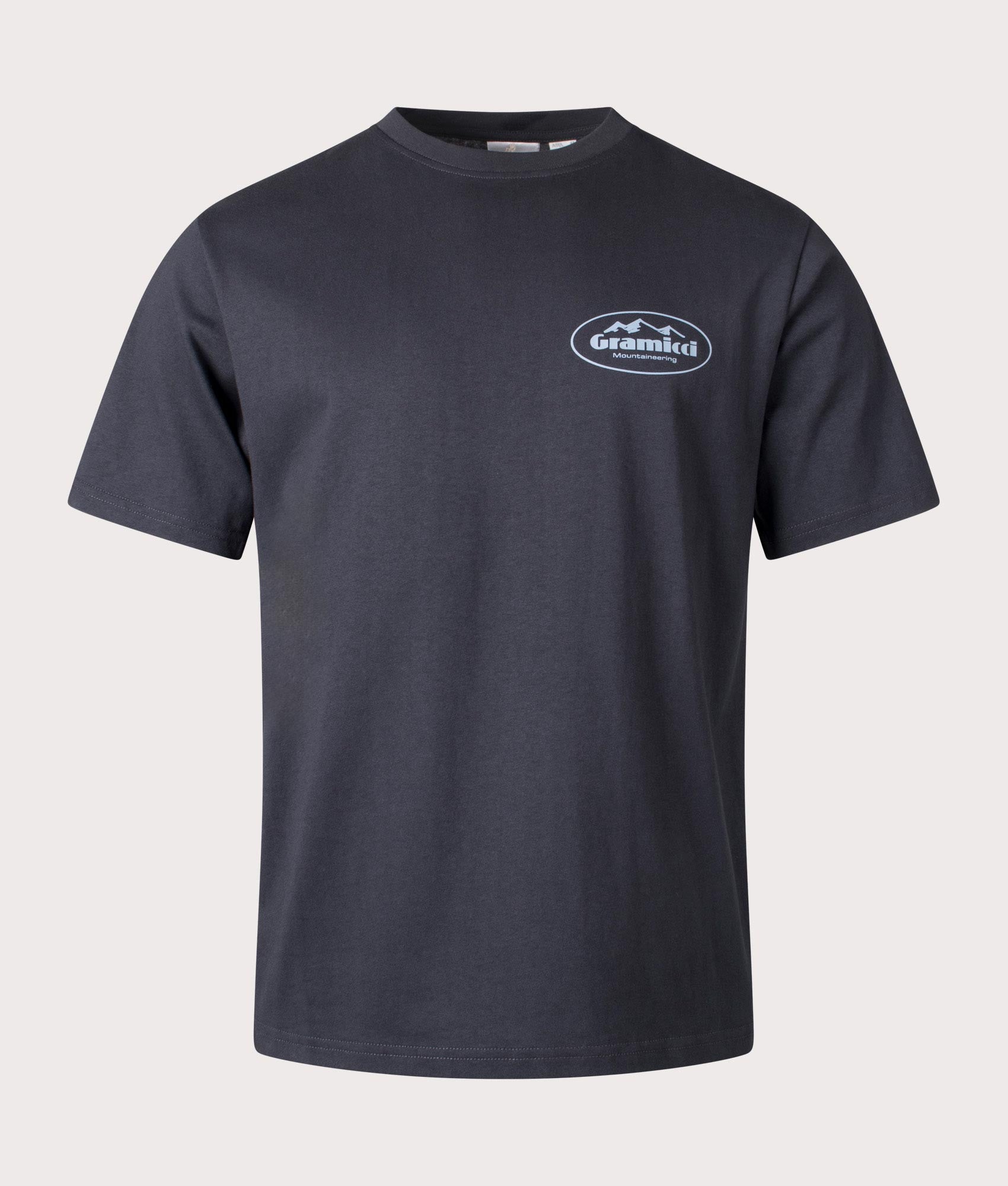 Gramicci Mountaineering T-shirt in Vintage black with front and back graphics, 100% organic cotton at EQVVS menswear. Front shot. 