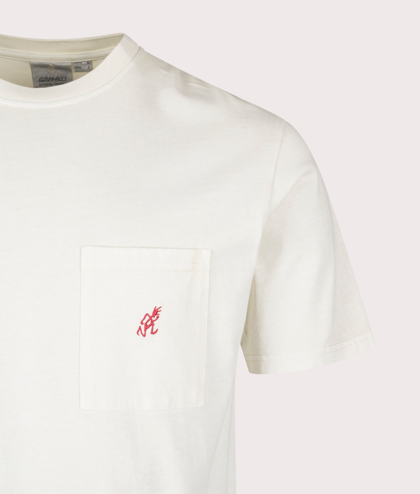 Gramicci One Point Pigment Dyed T-Shirt in Natural Pigment at EQVVS Menswear. Detail shot.
