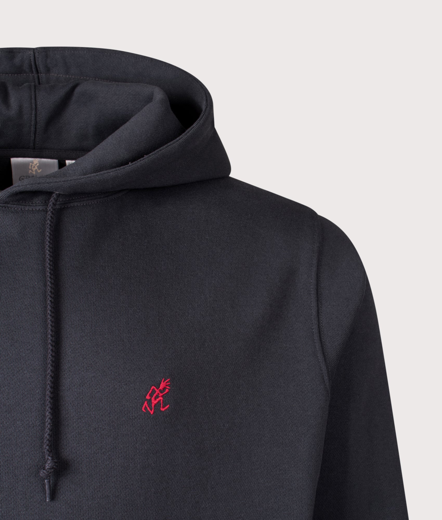 Gramicci One Point hoodie in Vintage Black at EQVVS Menswear. Detail shot.