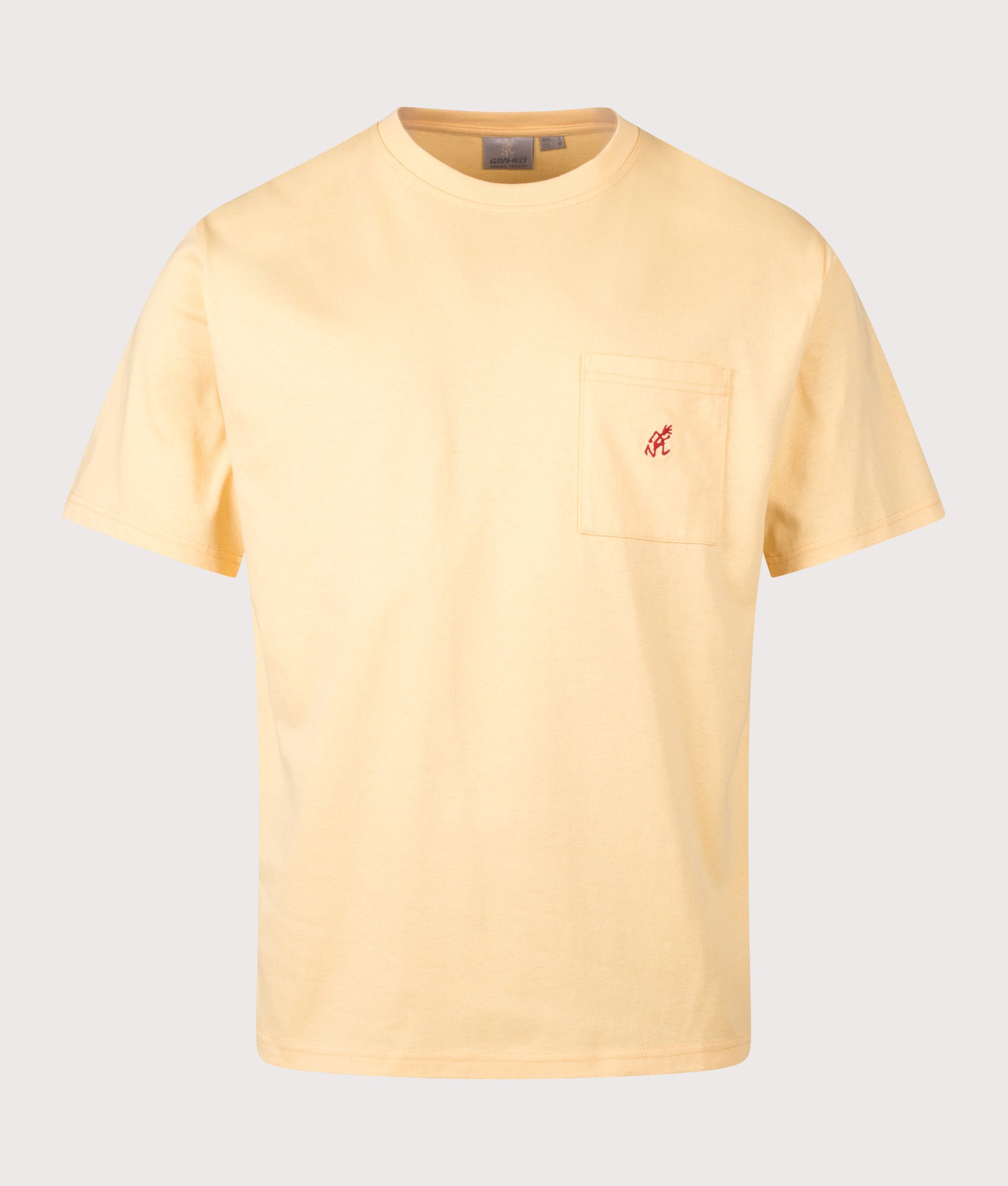 Gramicci One Point T-Shirt in Mango at EQVVS Menswear. Front shot.