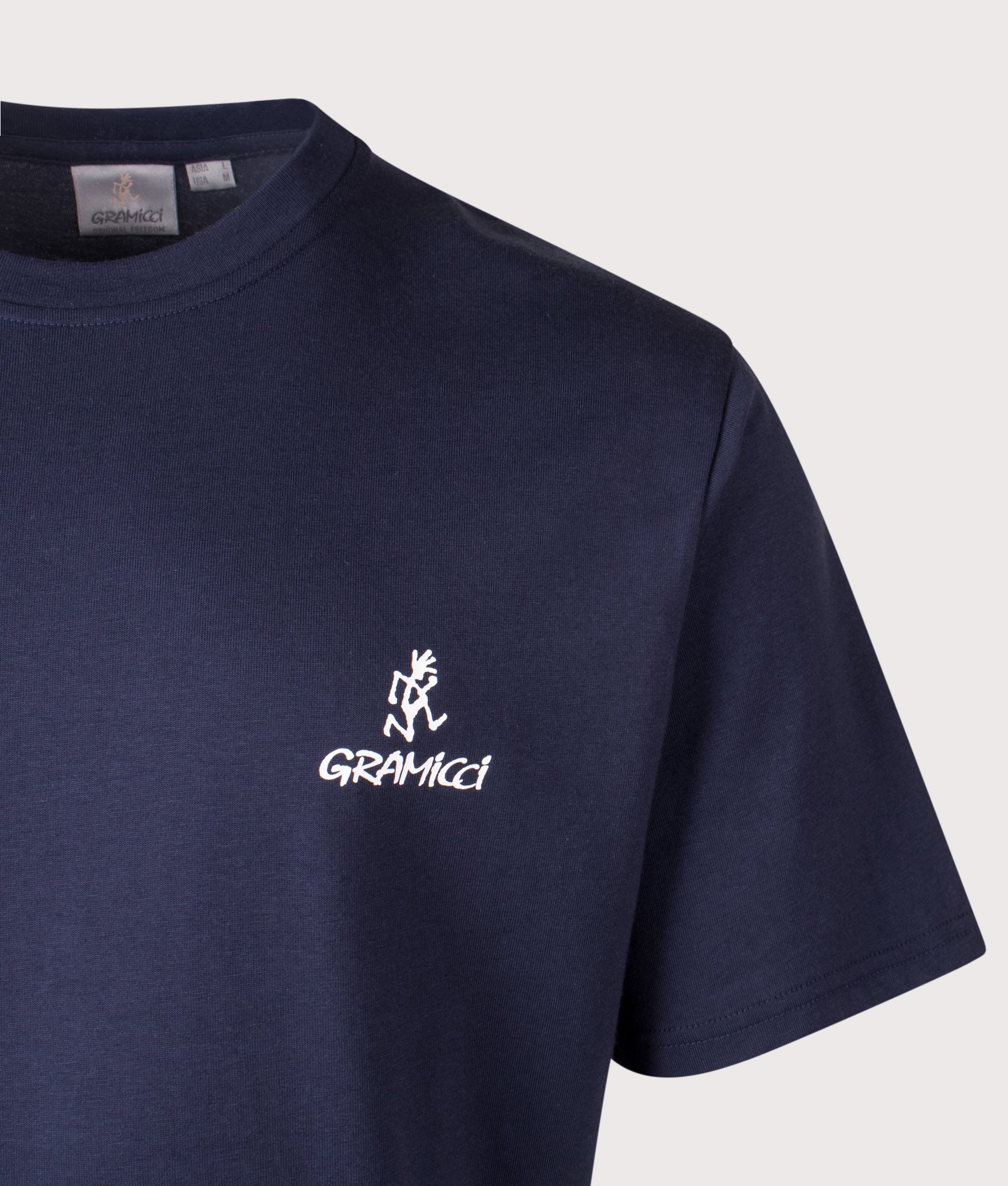 Gramicci One Point Logo T-Shirt in Navy at EQVVS Menswear. Detail shot. 