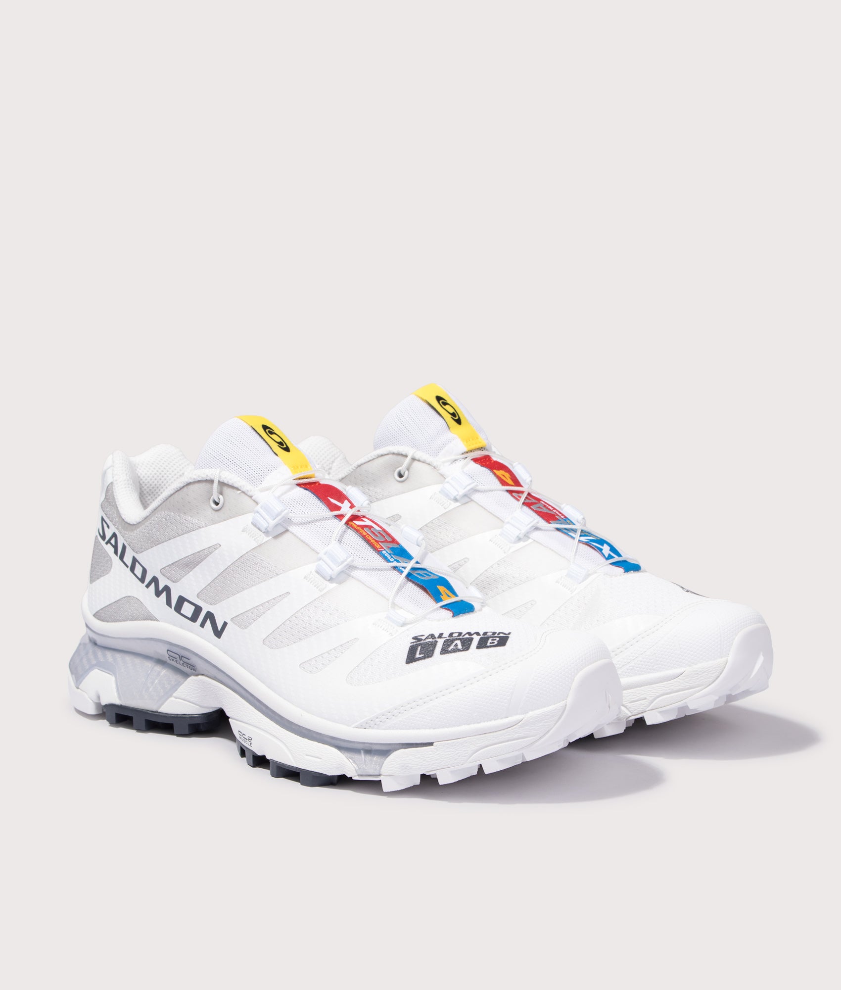 SALOMON XT-4 OG Sneakers in White, Ebony and Lunar Rock at EQVVS Menswear. Angled front shot.