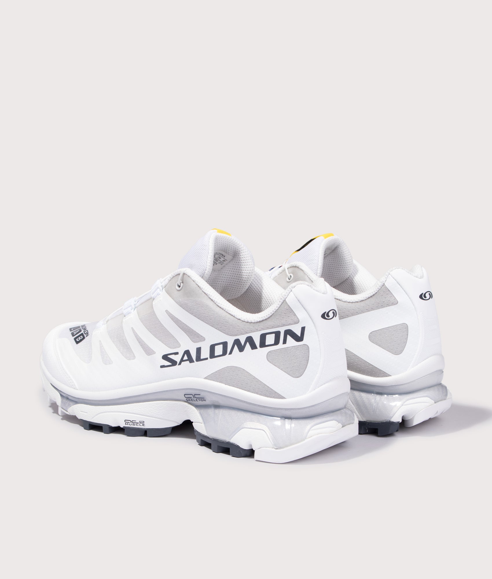 SALOMON XT-4 OG Sneakers in White, Ebony and Lunar Rock at EQVVS Menswear. Angled back shot.
