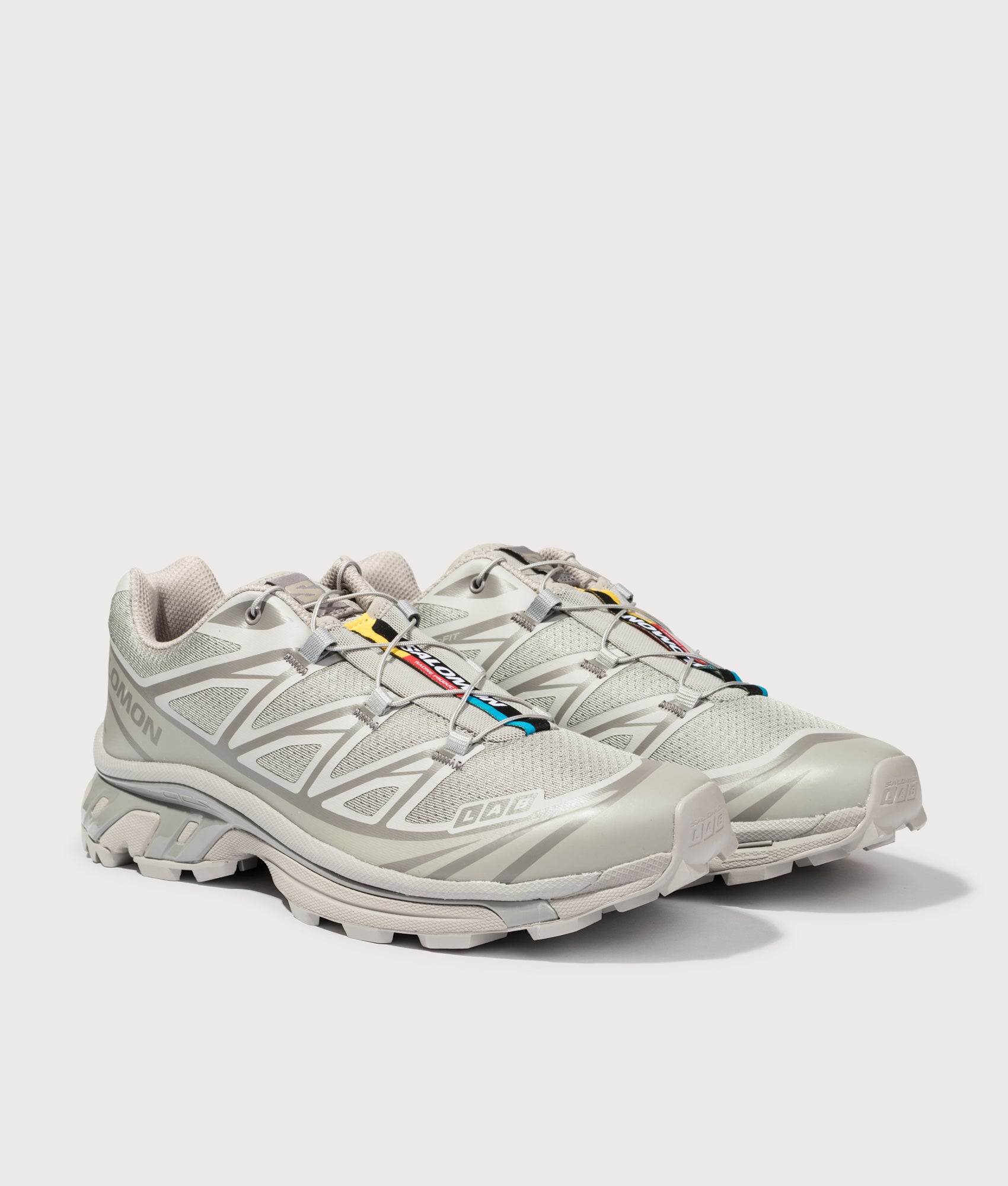 SALOMON XT-6 in Ghost Gray and Gray Flannel at EQVVS Menswear. Angled front shot.