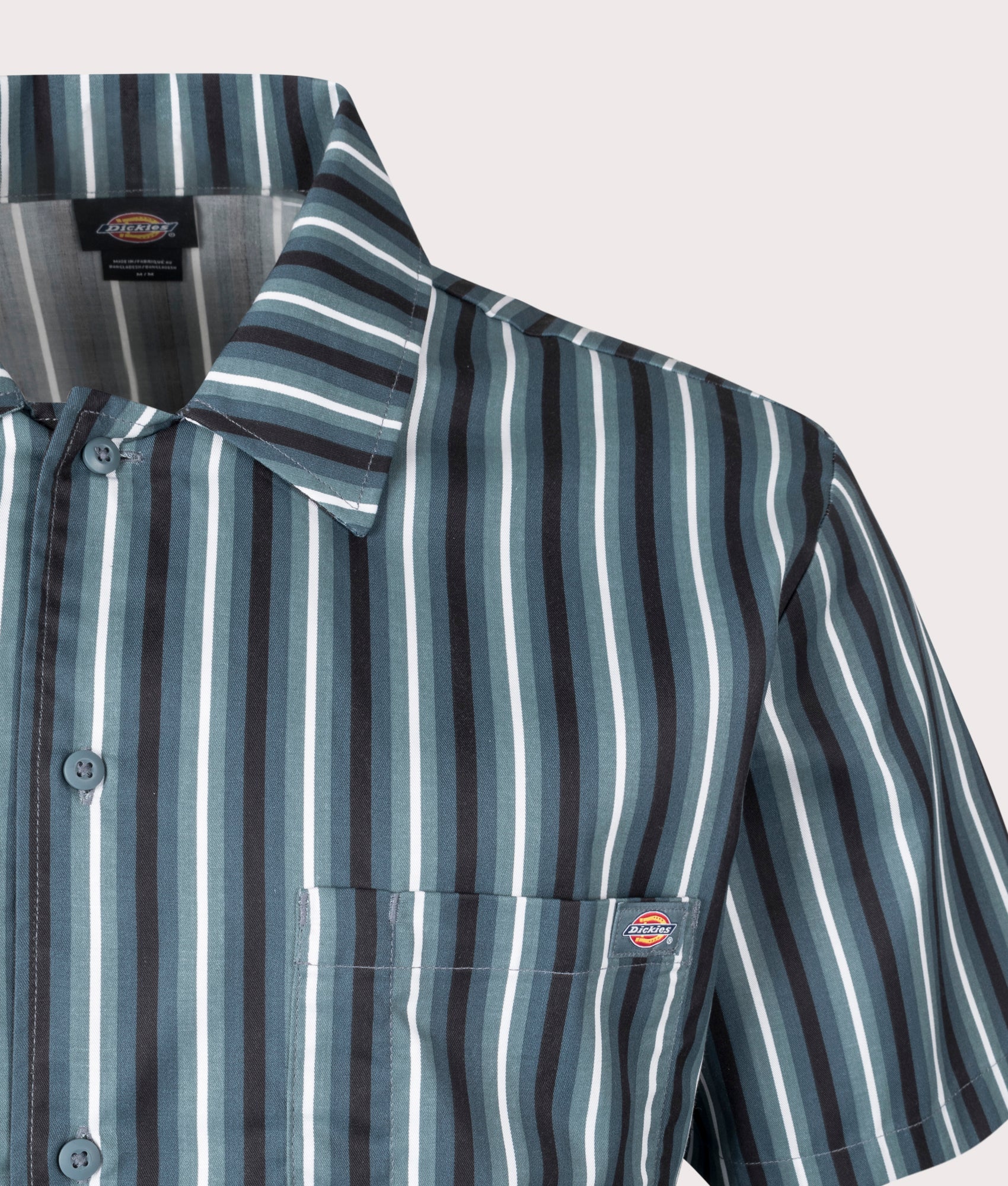 Dickies Multi Stripe Short Sleeve Work Shirt in Stormy Weather. Shot at EQVVS.  Front logo shot 