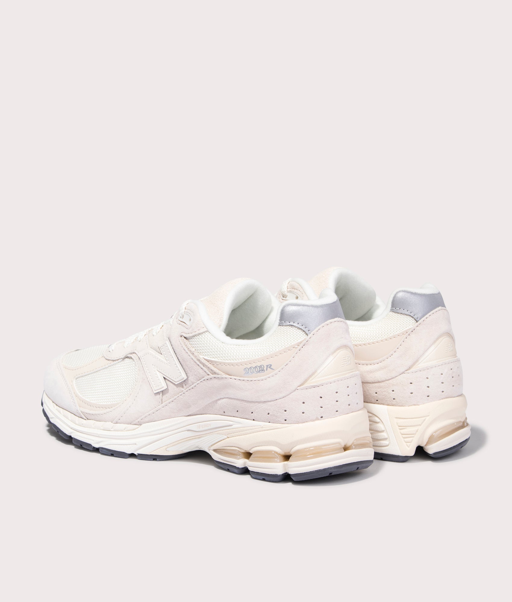 New Balance 2002R Sneakers in Calm Taupe. Back angle shot at EQVVS.
