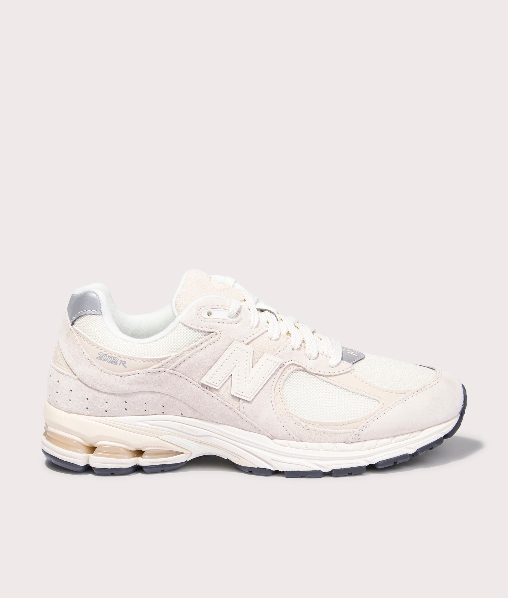 New Balance 2002R Sneakers in Calm Taupe. Side angle shot at EQVVS.