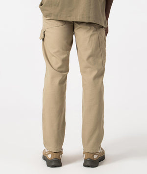 Dickies Duck Carpenter Pants in Stone Washed Desert Sand. Back angle shot at EQVVS.