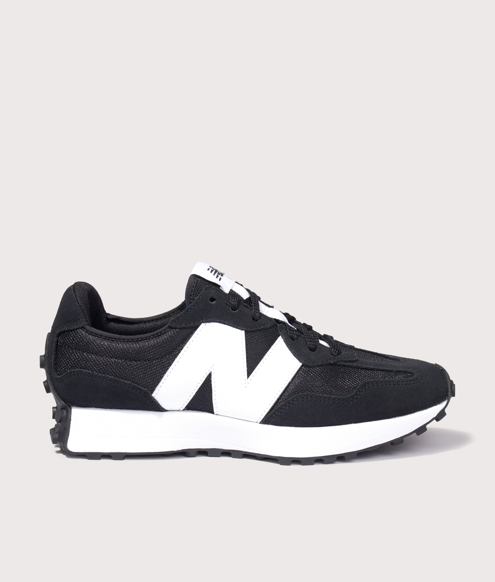 New Balance 327 Sneakers in Black at EQVVS Menswear. Side shot.