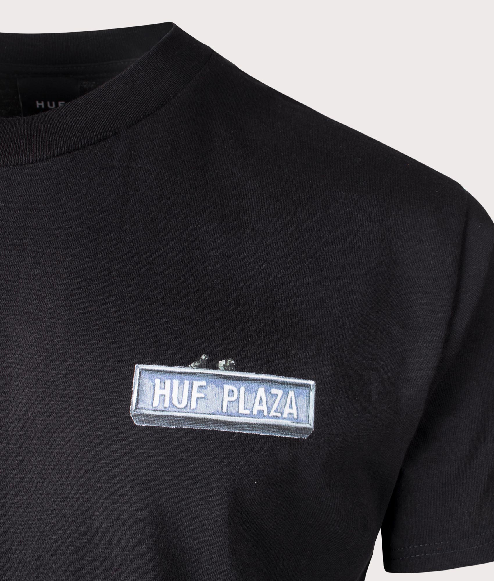 HUF Plaza T-Shirt in Black. Shot at EQVVS. Front logo shot 