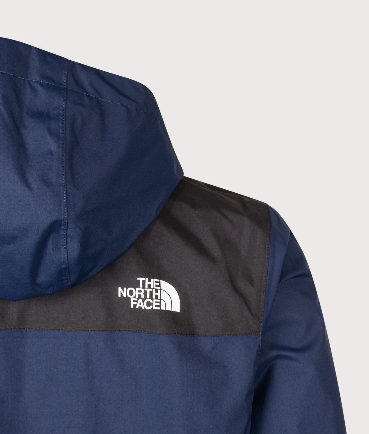 The North Face Regular Fit Antora Jacket in  Summit Navy and TNF Black at EQVVS Menswear. Back detail shot.