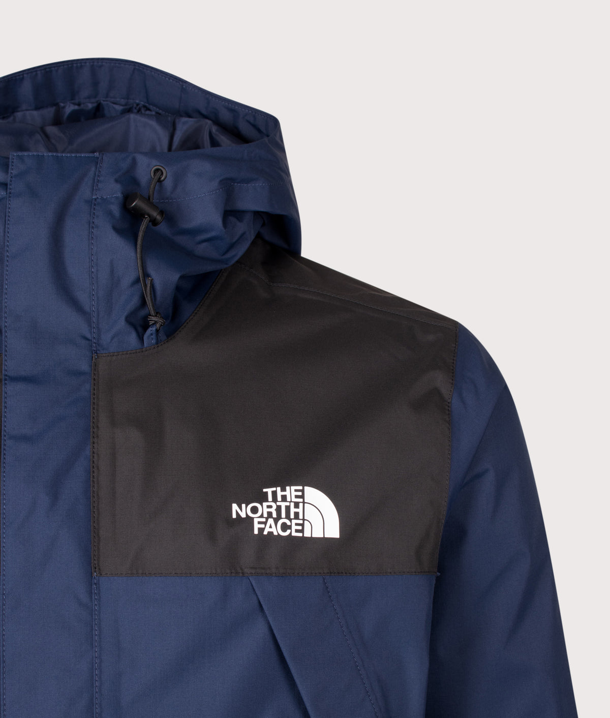 The North Face Regular Fit Antora Jacket in  Summit Navy and TNF Black at EQVVS Menswear. Detail shot.