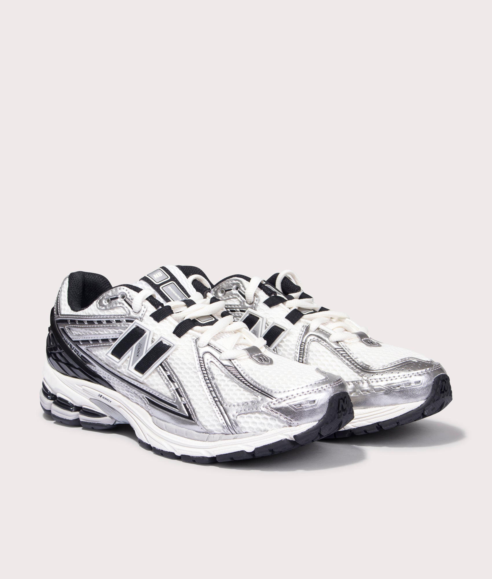 New Balance 1906R Sneakers in Silver Metallic. Side angle shot at EQVVS.