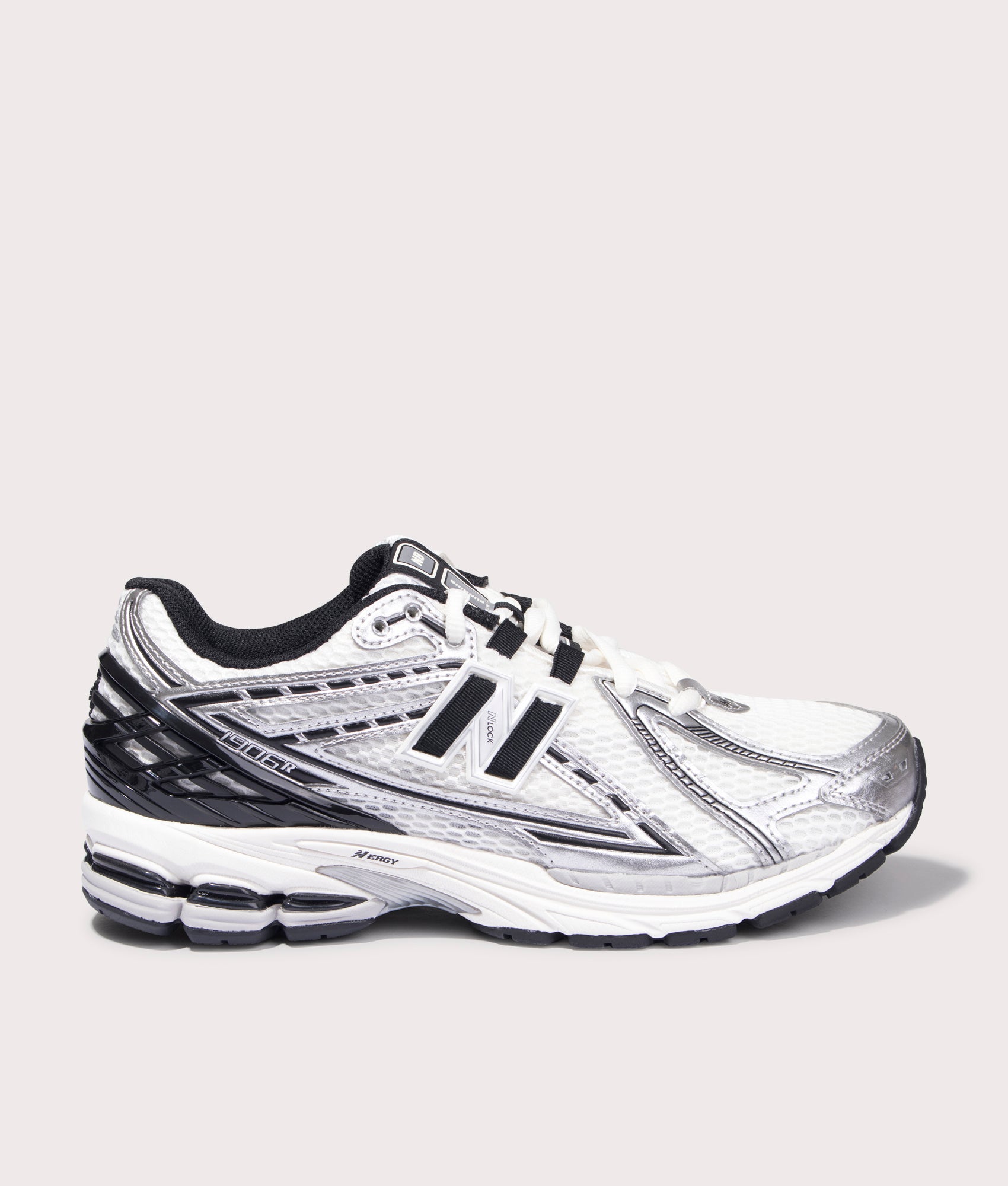 New Balance 1906R Sneakers in Silver Metallic. Side angle shot at EQVVS.