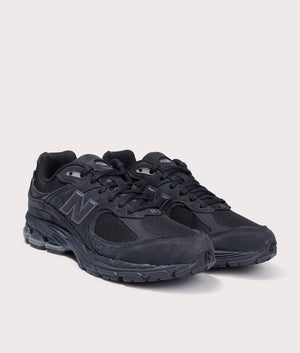 New Balance 2002R Sneakers in Phantom. Suede and Textile Upper. At EQVVS Menswear. Front right angle shot