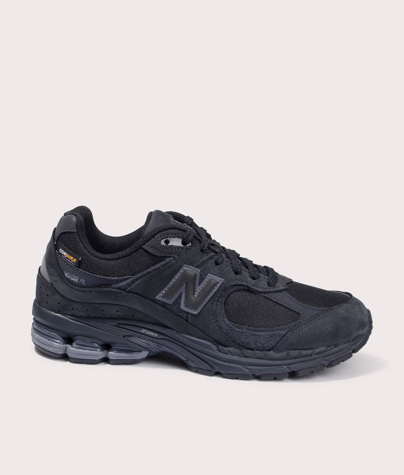 New Balance 2002R Sneakers in Phantom, Suede and Textile Upper. At EQVVS Menswear. Side detail shot
