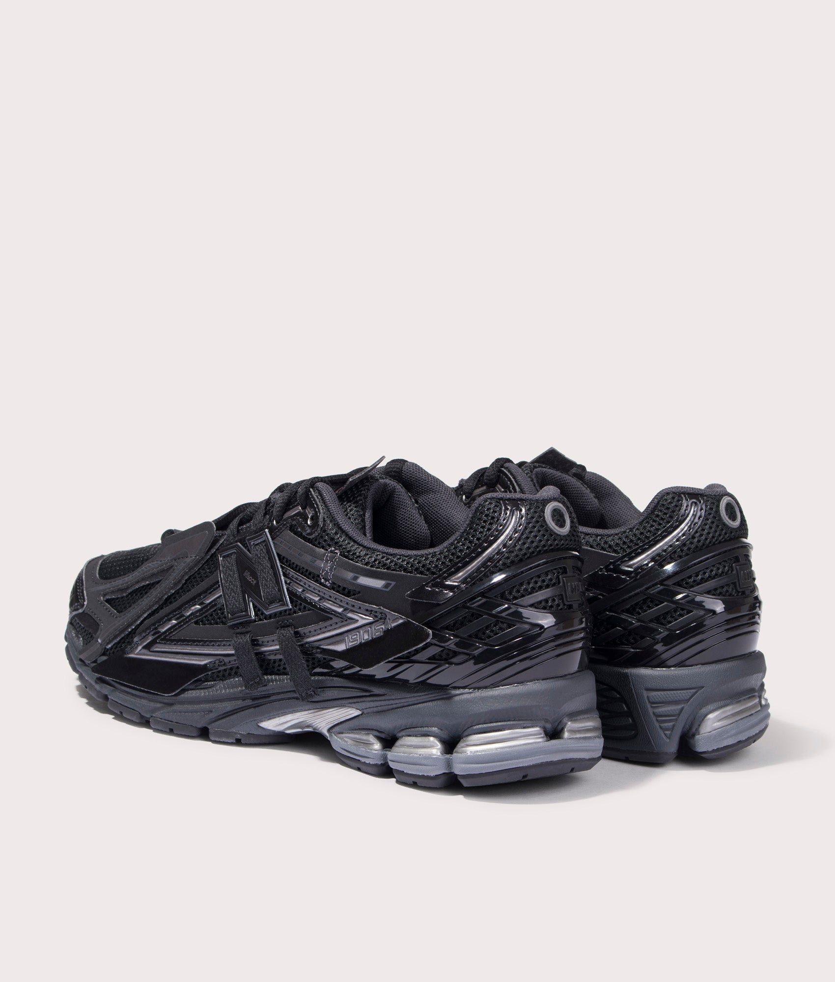 1906A Trainers New Balance, Black. Shot at EQVVS. Back left angle shot. 