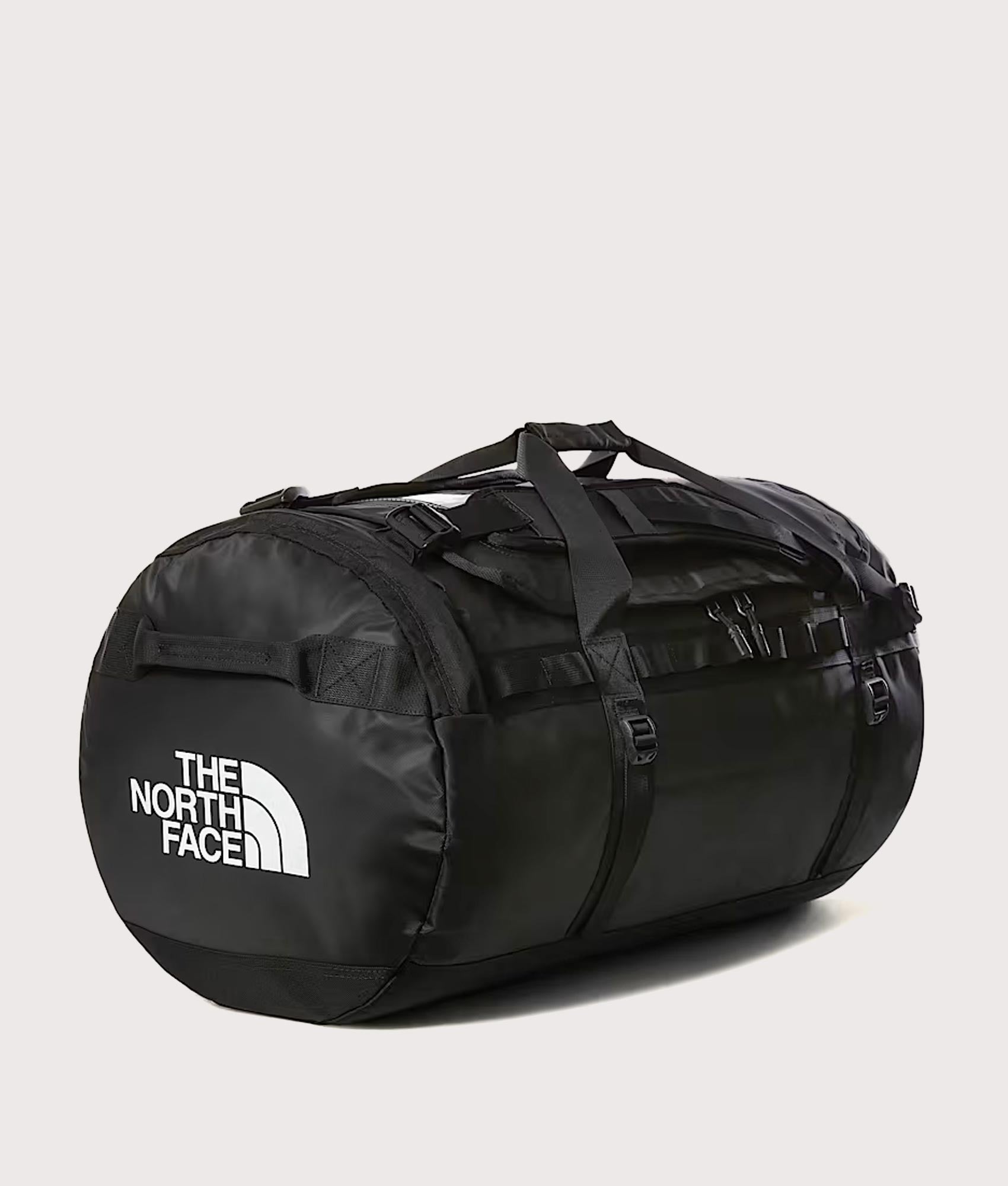 The North Face Large Base Camp Duffel Bag in TNF Black and TNF White at EQVVS Menswear.  Angled front shot.