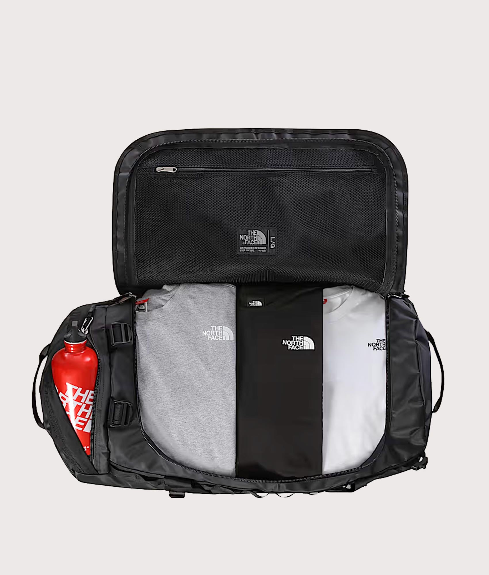 The North Face Large Base Camp Duffel Bag in TNF Black and TNF White at EQVVS Menswear. Open shot.