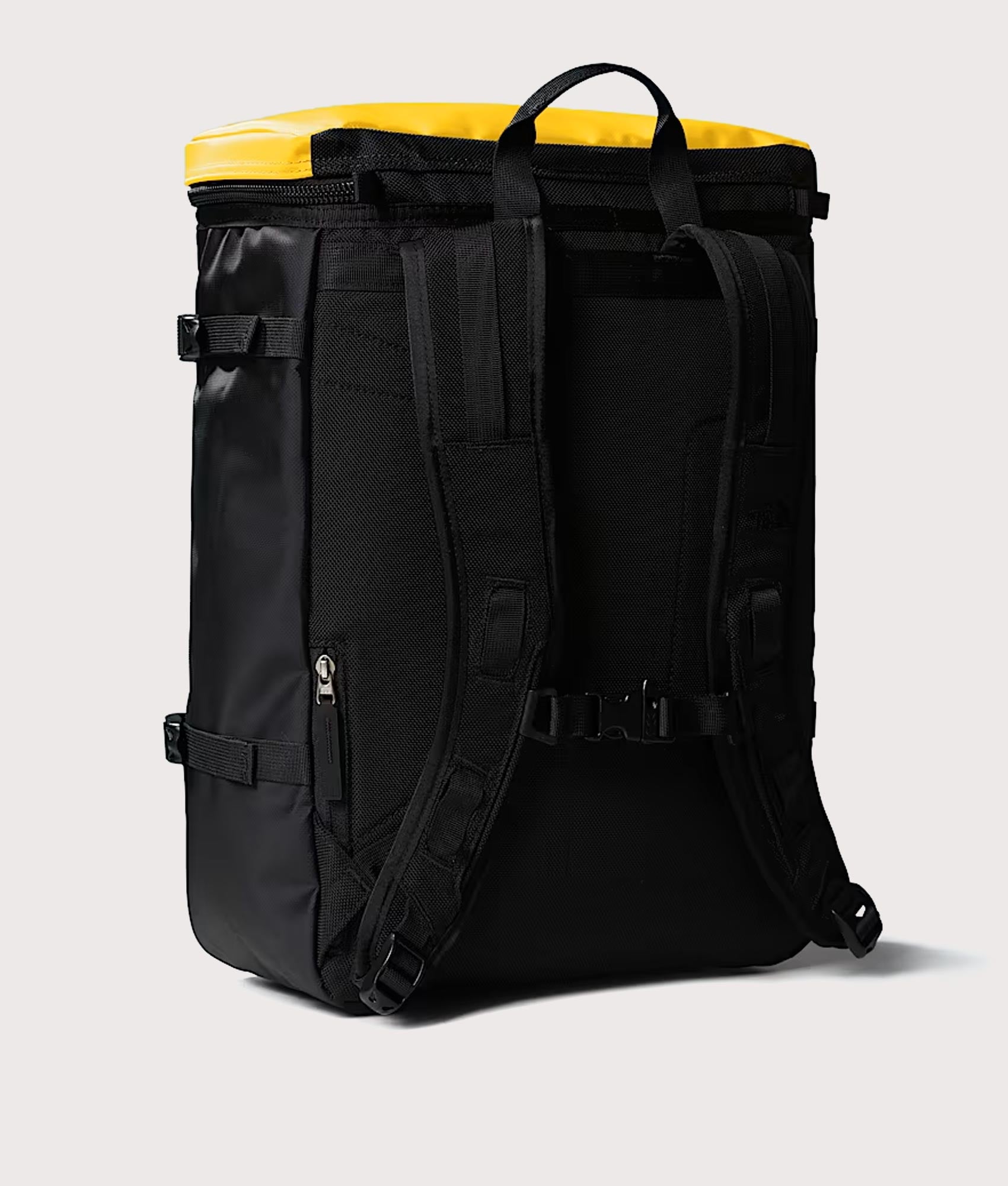The North Face Fuse Box Backpack in  Summit Gold and TNF Black at EQVVS Menswear. Back shot.
