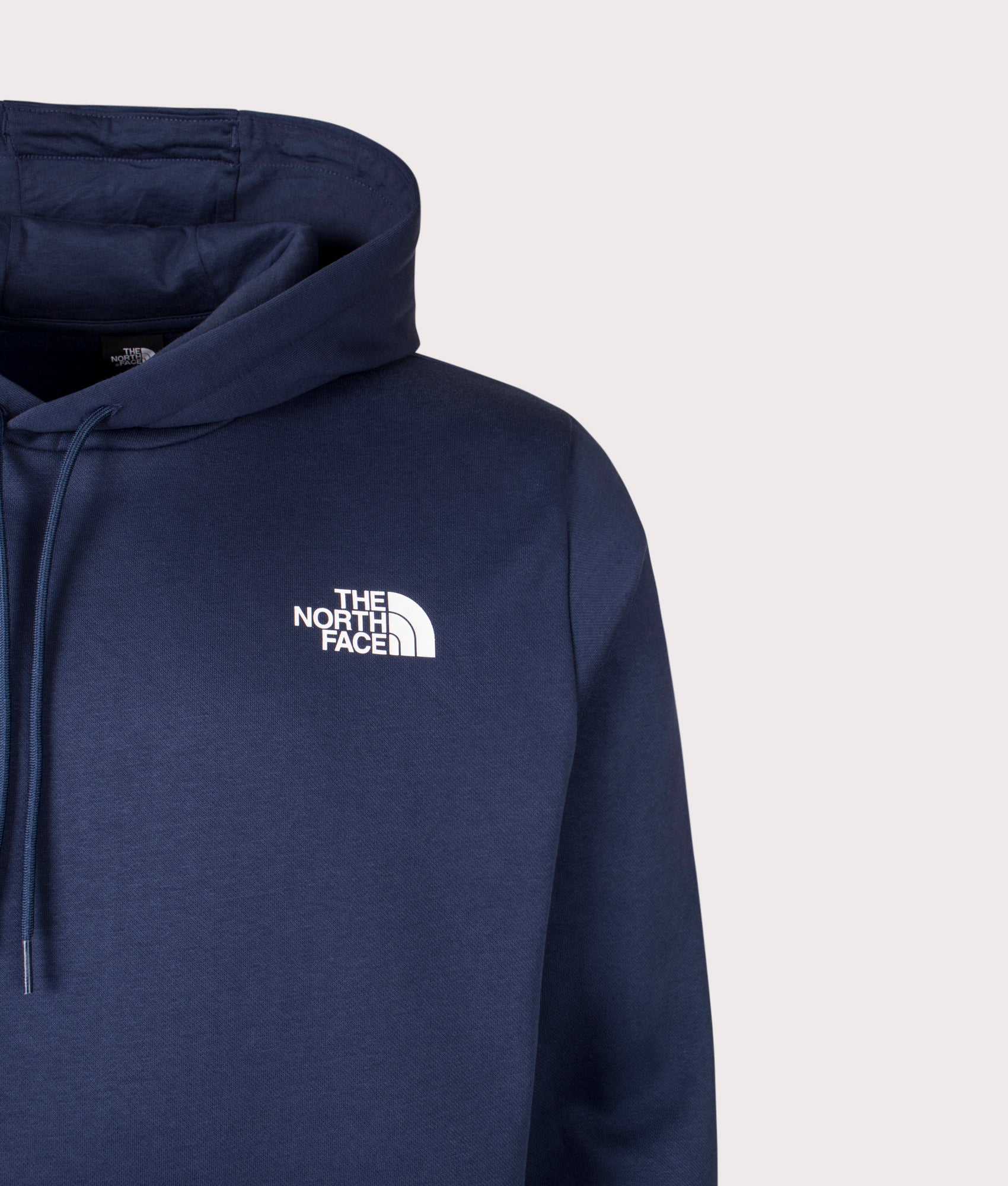 The North Face drop the The Simple Dome Hoodie in Summit Navy at EQVVS Menswear. Front detail shot.