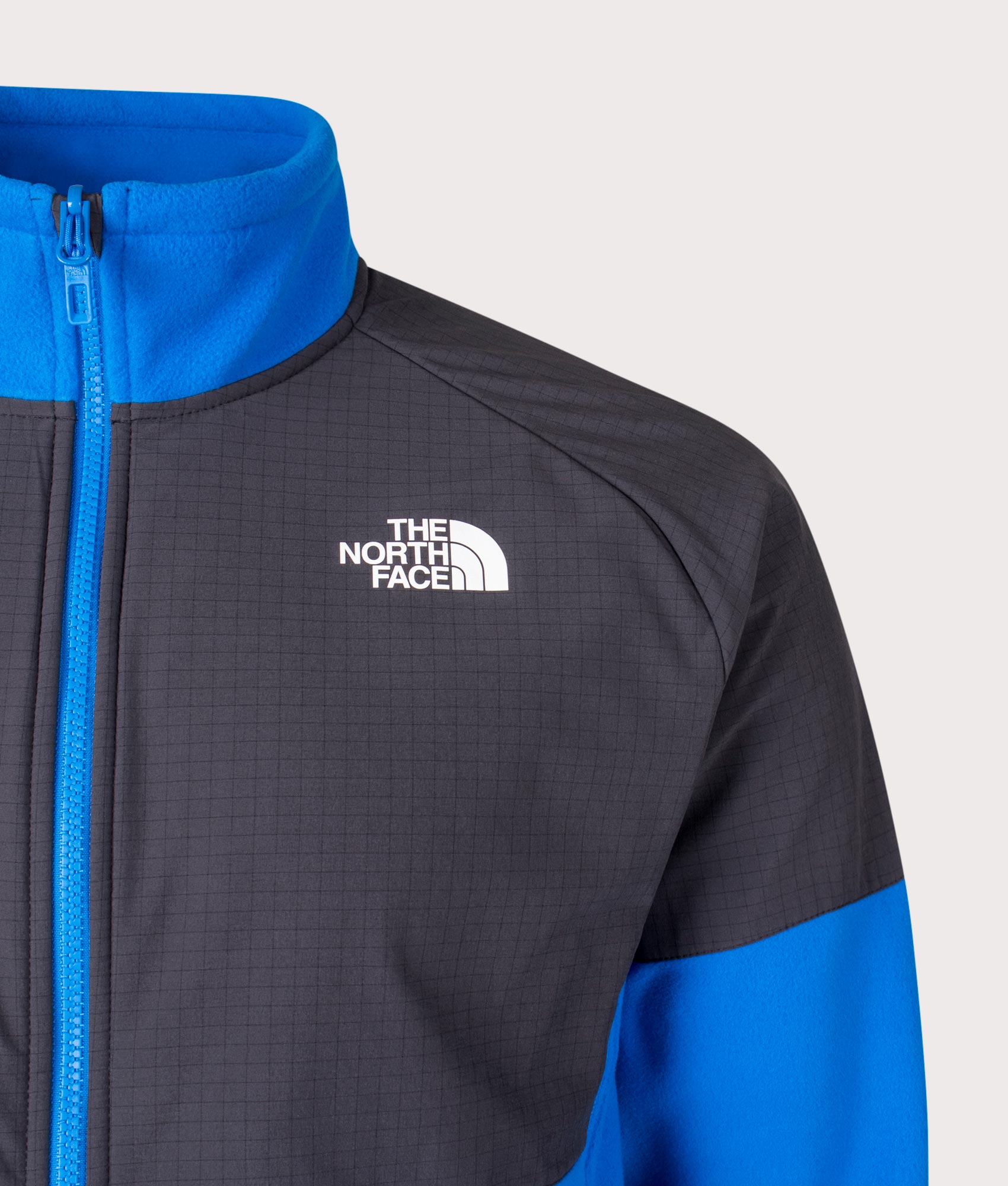 The North Face Glacier Heavyweight Zip Through Fleece in Hero Blue and Asphalt Grey at EQVVS Detail Shot.