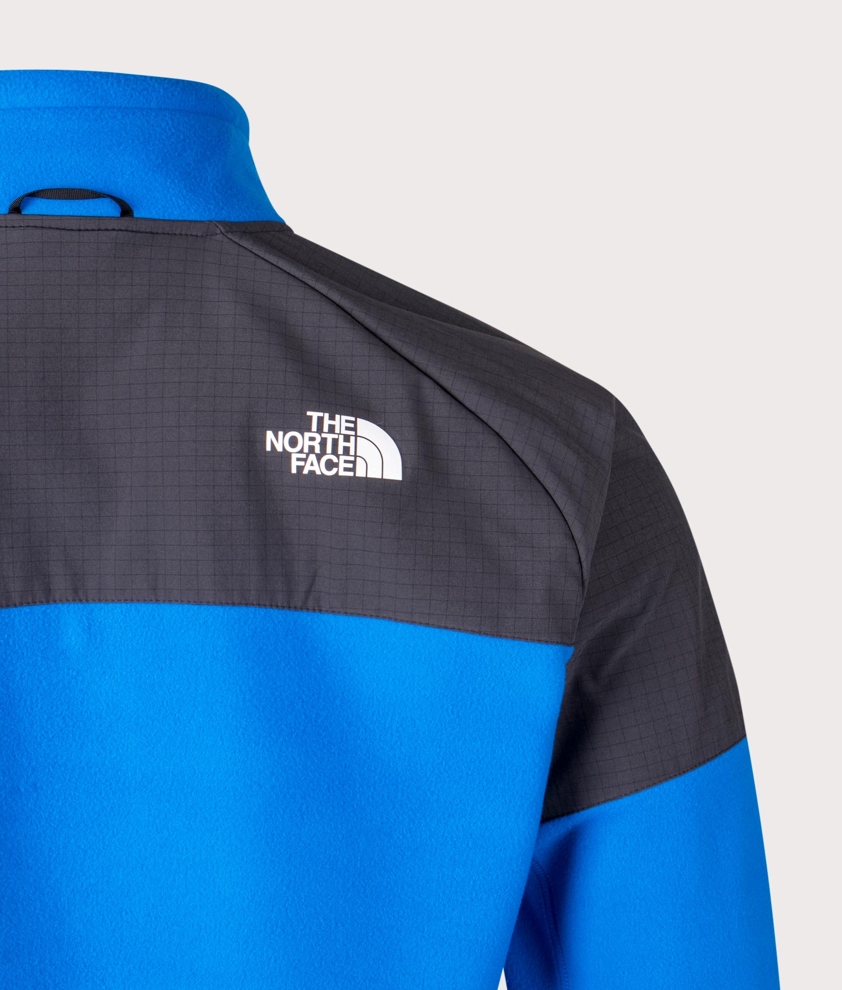 The North Face Glacier Heavyweight Zip Through Fleece in Hero Blue and Asphalt Grey at EQVVS Back Detail Shot.