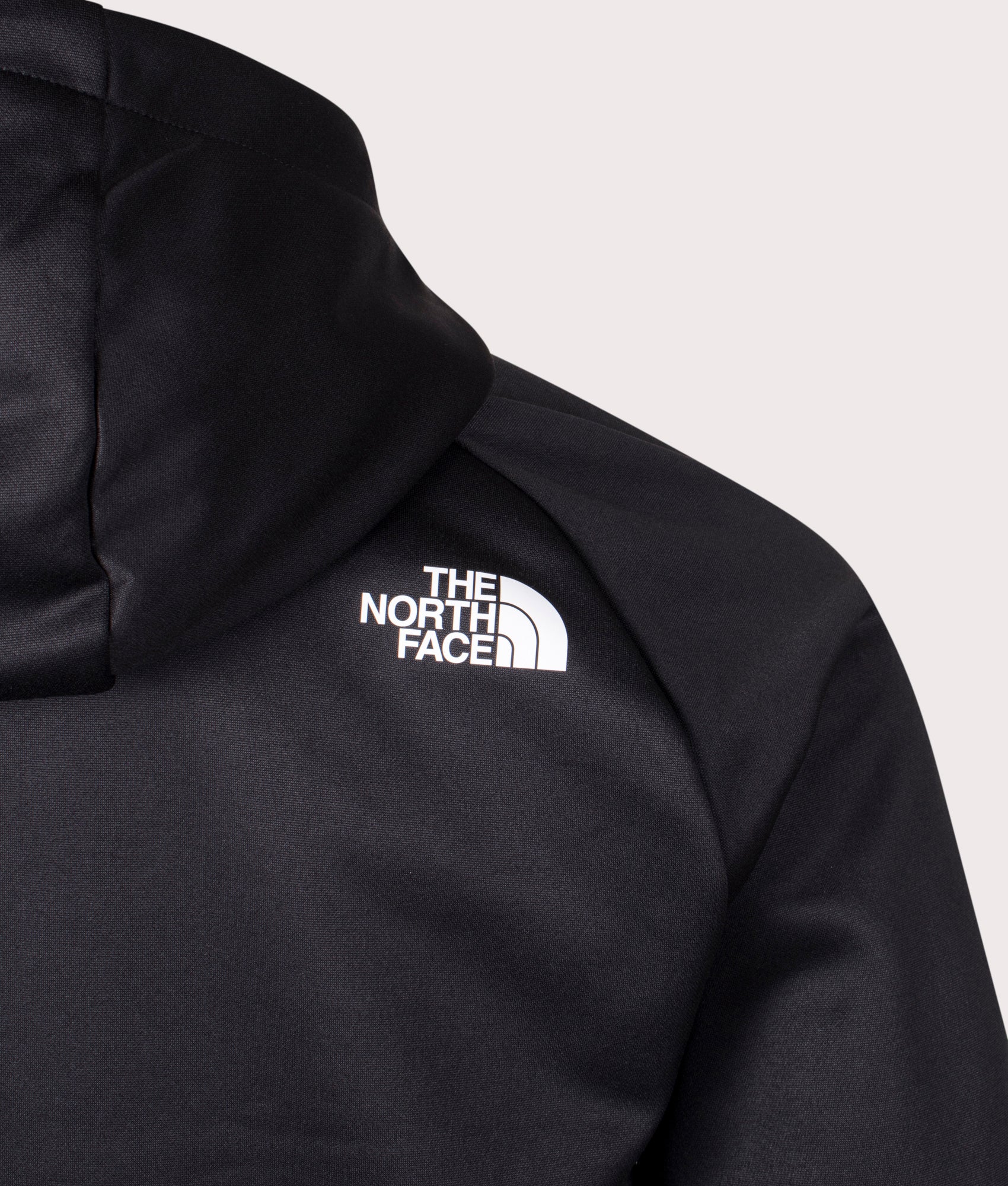 The North Face Reaxion Fleece Zip Through Hoodie in Black and Asphalt Grey at EQVVS. Back Detail Shot.