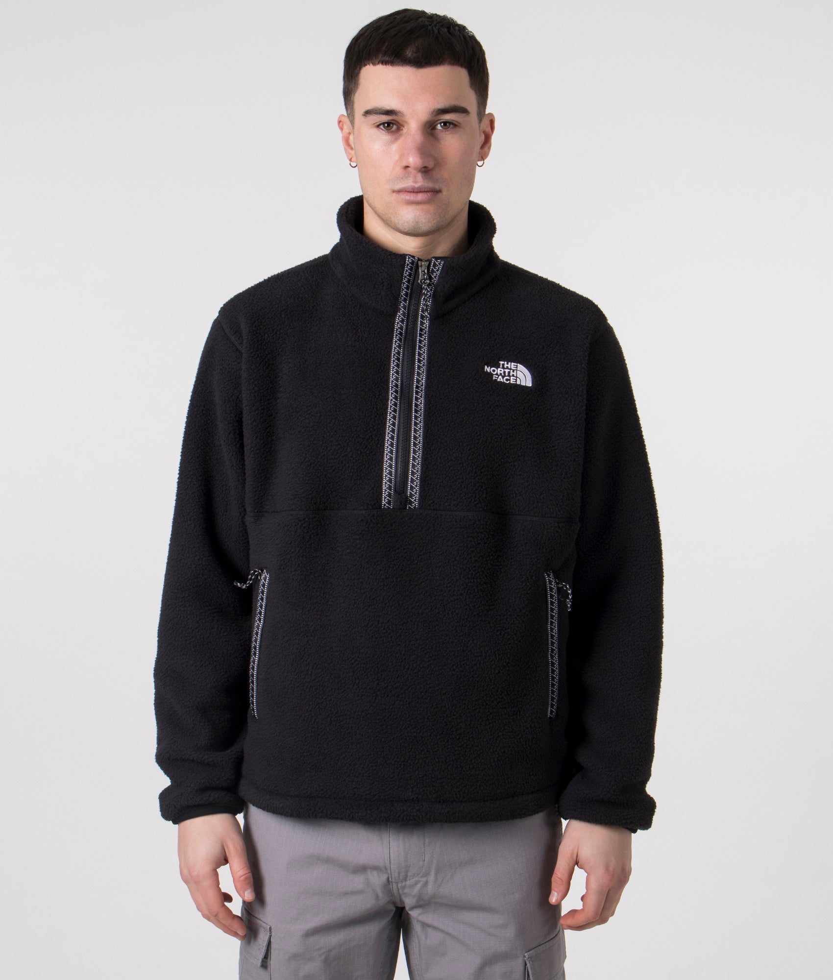 The North Face TNF Quarter Zip Fleeski in Black. Shot at EQVVS.  Model shot front. 