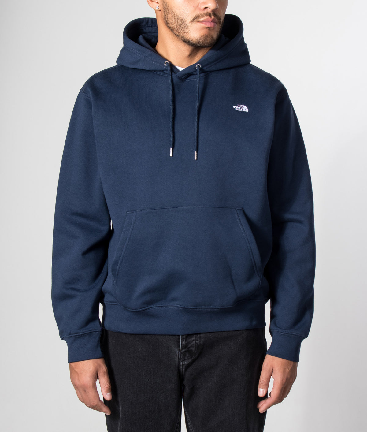 The North Face Relaxed Fit Essential Simple Dome Hoodie in Summit Navy at EQVVS Menswear. Model front shot.
