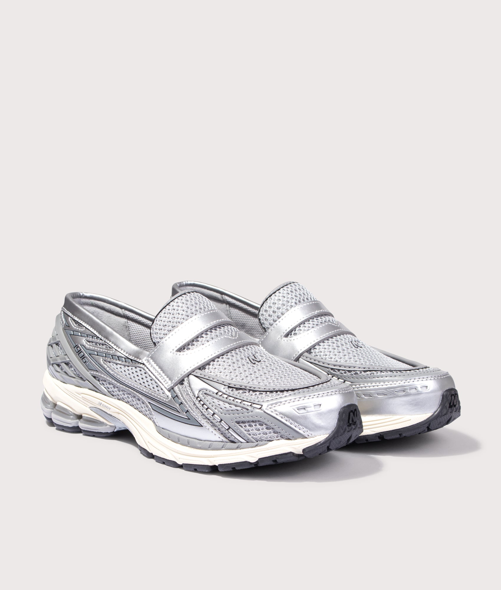 New Balance 1906L Loafers in Silver/Shadow Grey/Turtledove at EQVVS Menswear. Angled front shot.