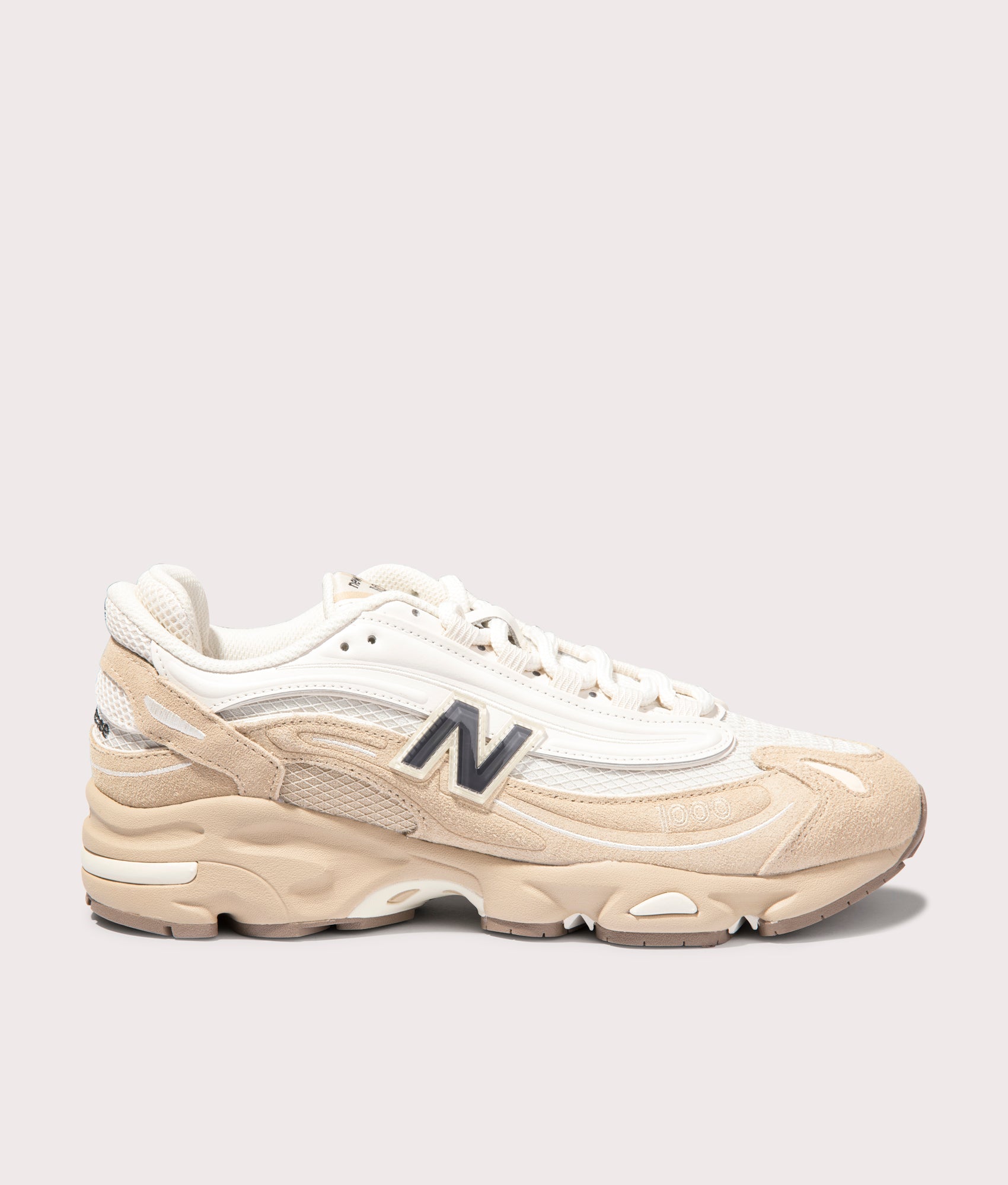 1000 Sneakers in Incense by New Balance. Shot at EQVVS. Side shot