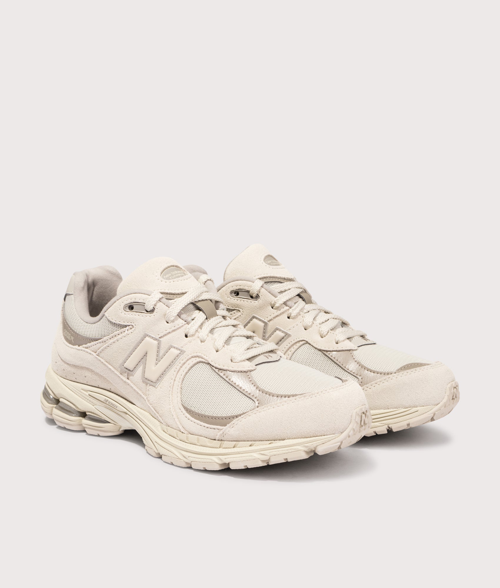 New Balance  2002R Sneakers in Timberwolf . Shot at EQVVS. Front angle shot 