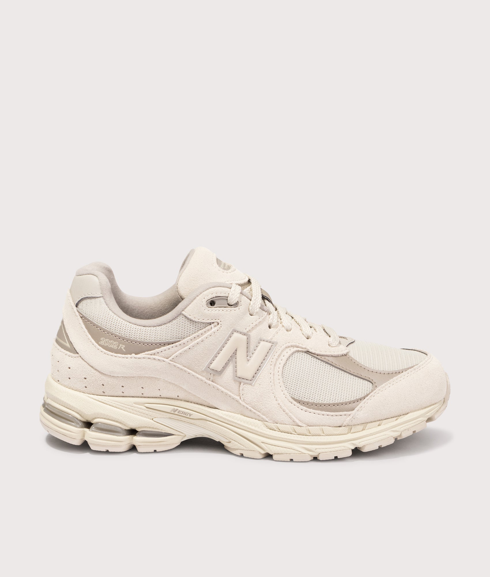 New Balance  2002R Sneakers in Timberwolf . Shot at EQVVS. Side shot 