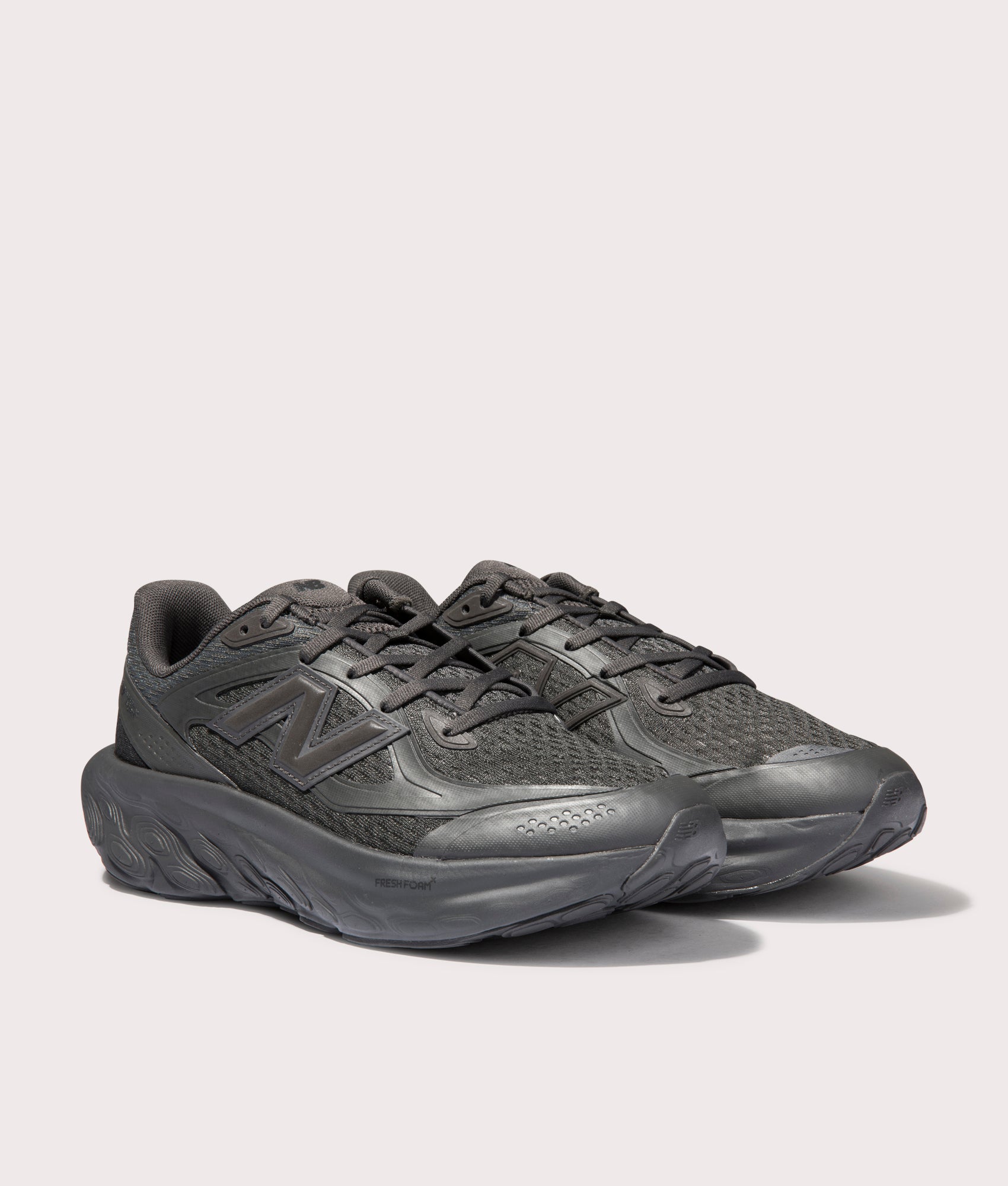 New Balance TRN Sneakers in Cement Black. Shot at EQVVS. Front angle shot 