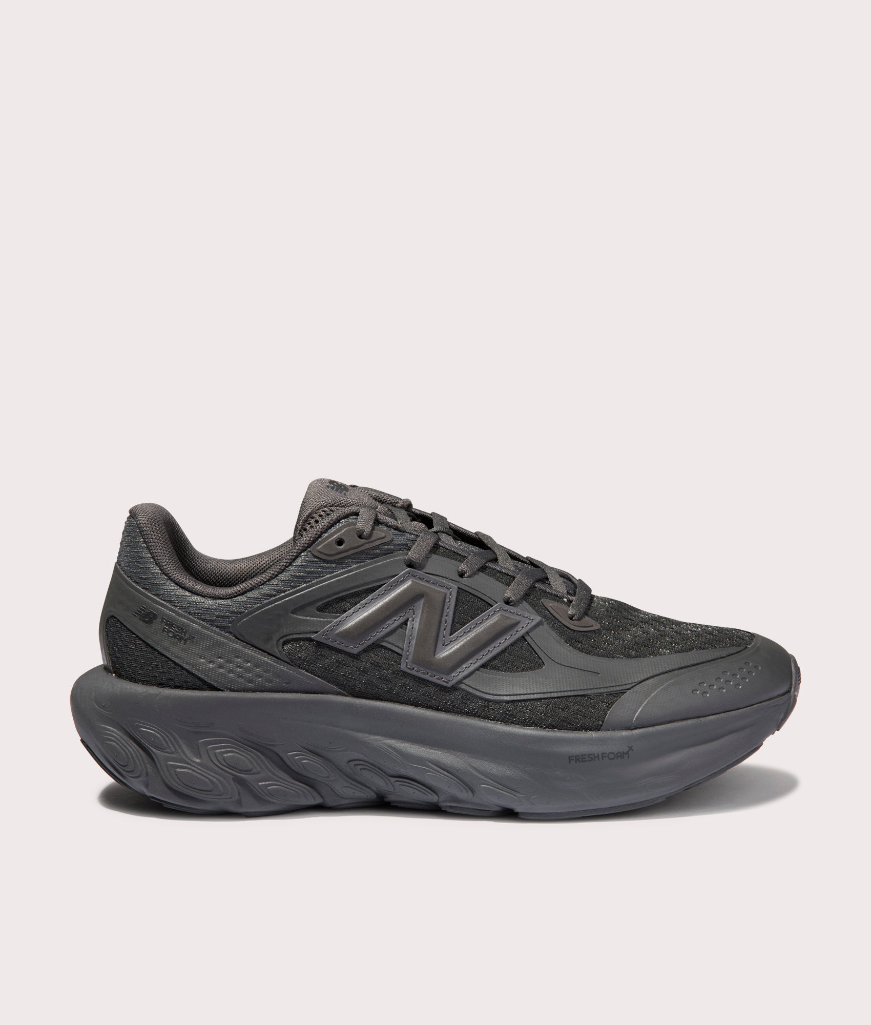 New Balance TRN Sneakers in Cement Black. Shot at EQVVS. Side shot 