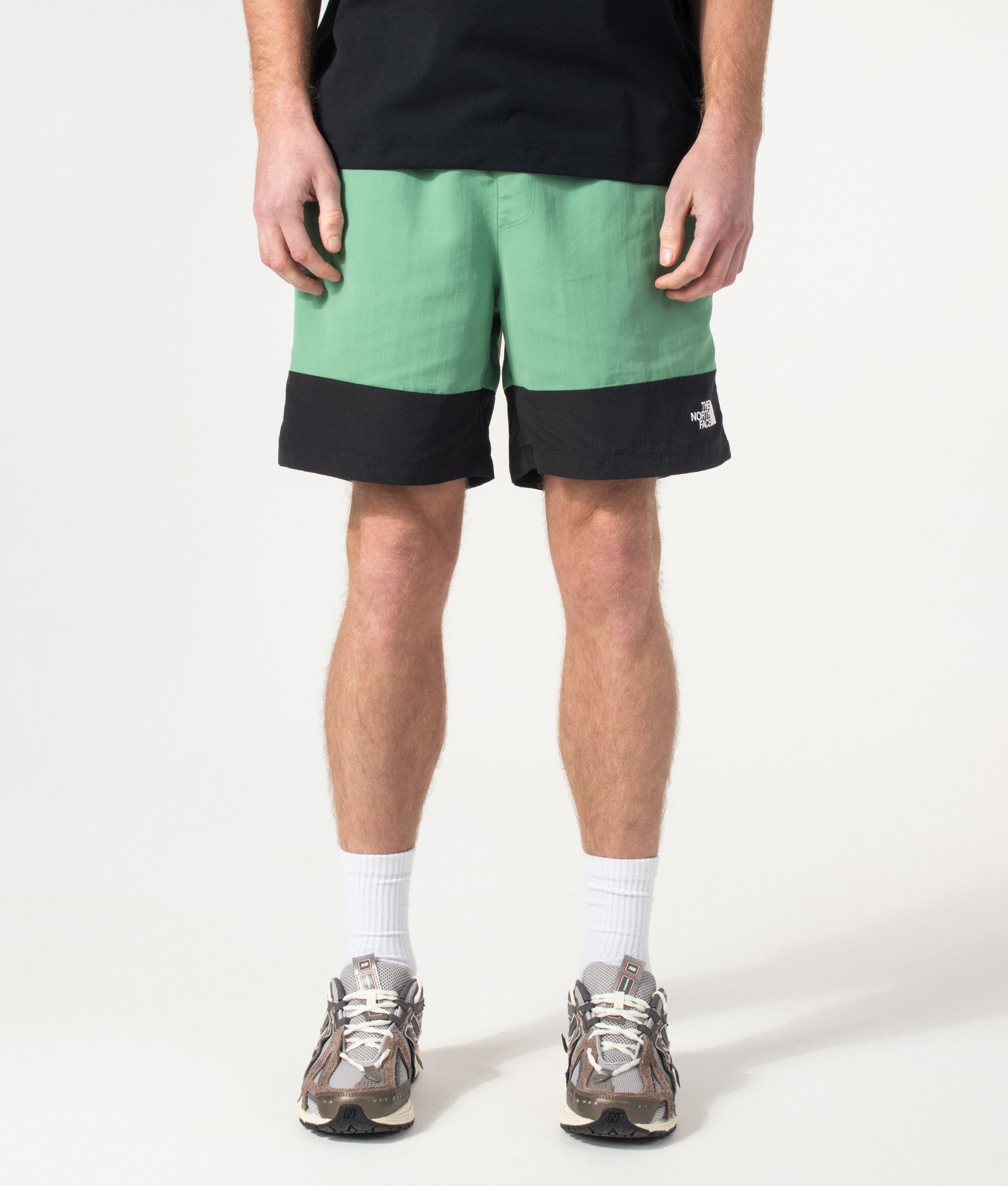 The North Face Leynar Shorts in Dimmed Algae and TNF Black at EQVVS Menswear. Model front shot.