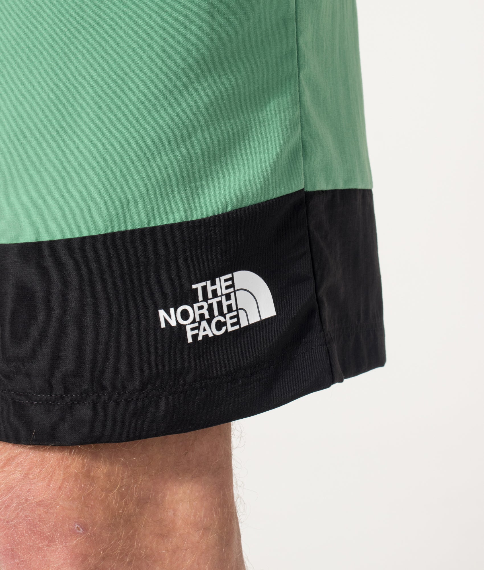 The North Face Leynar Shorts in Dimmed Algae and TNF Black at EQVVS Menswear. Detail shot.