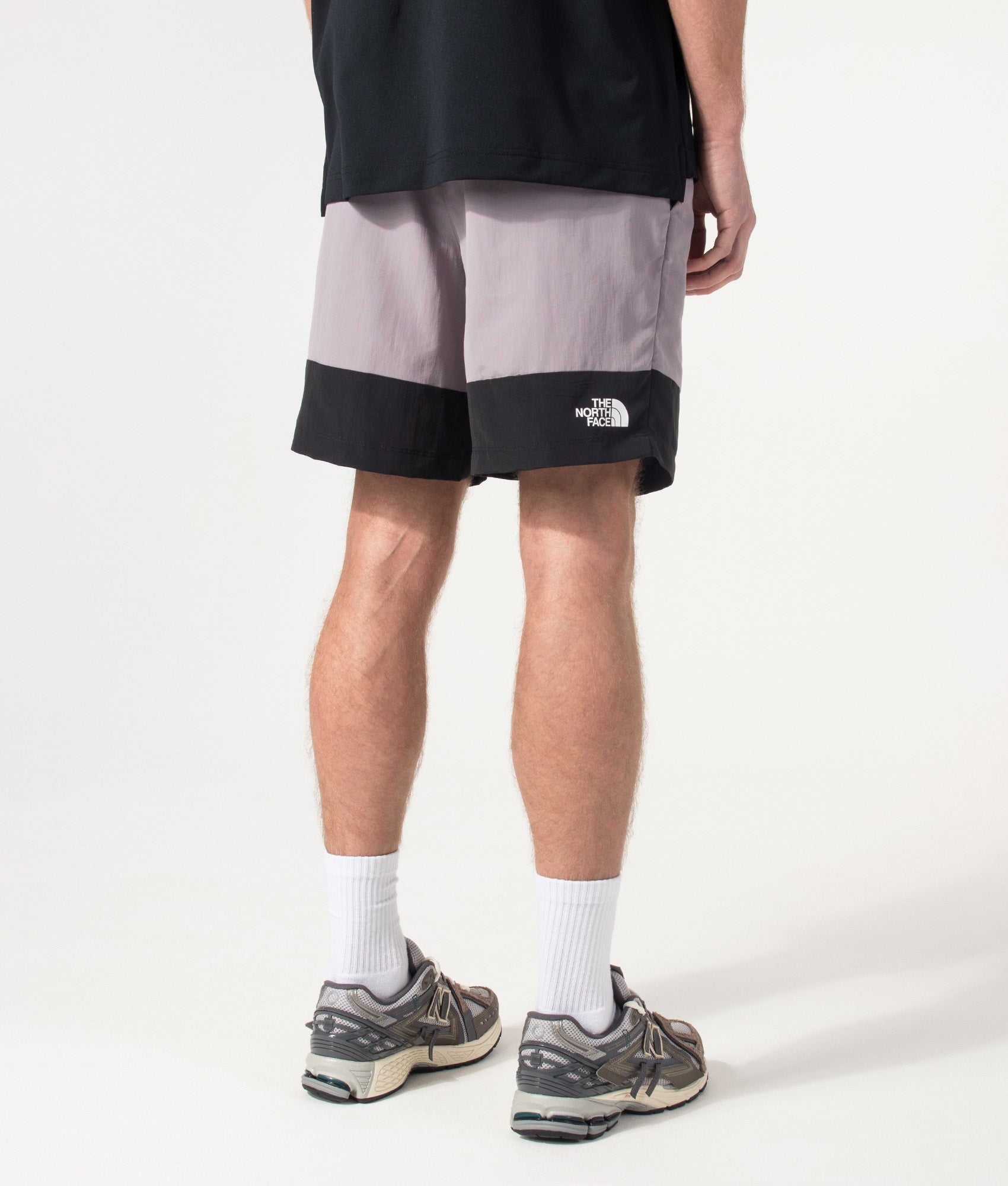The North Face Leynar Shorts in Transcendent Grey and TNF Black at EQVVS Menswear. Model angled back shot.