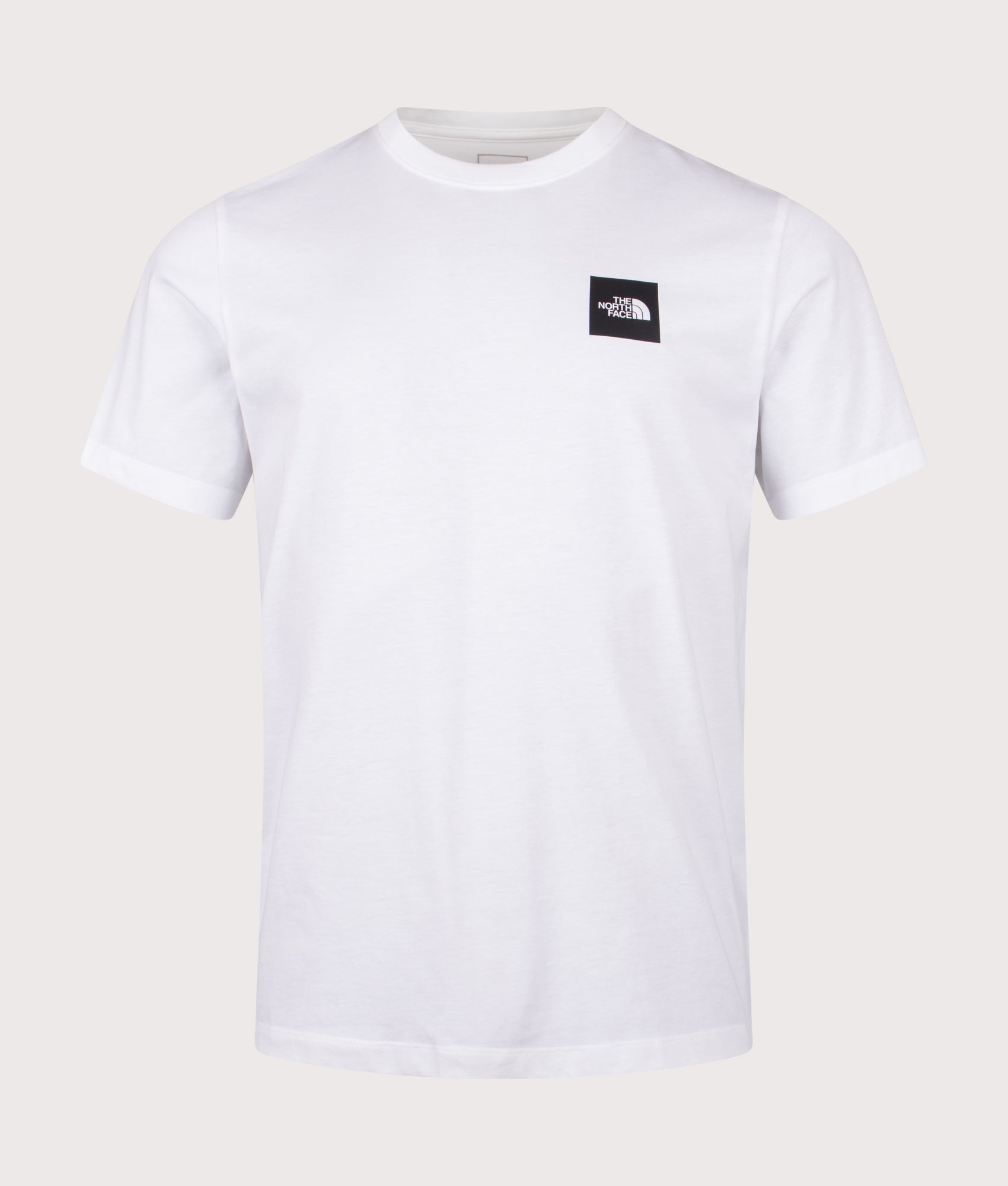 The North Face Evolution Box Half Dome T-Shirt in TNF White at EQVVS Menswear. Front shot.