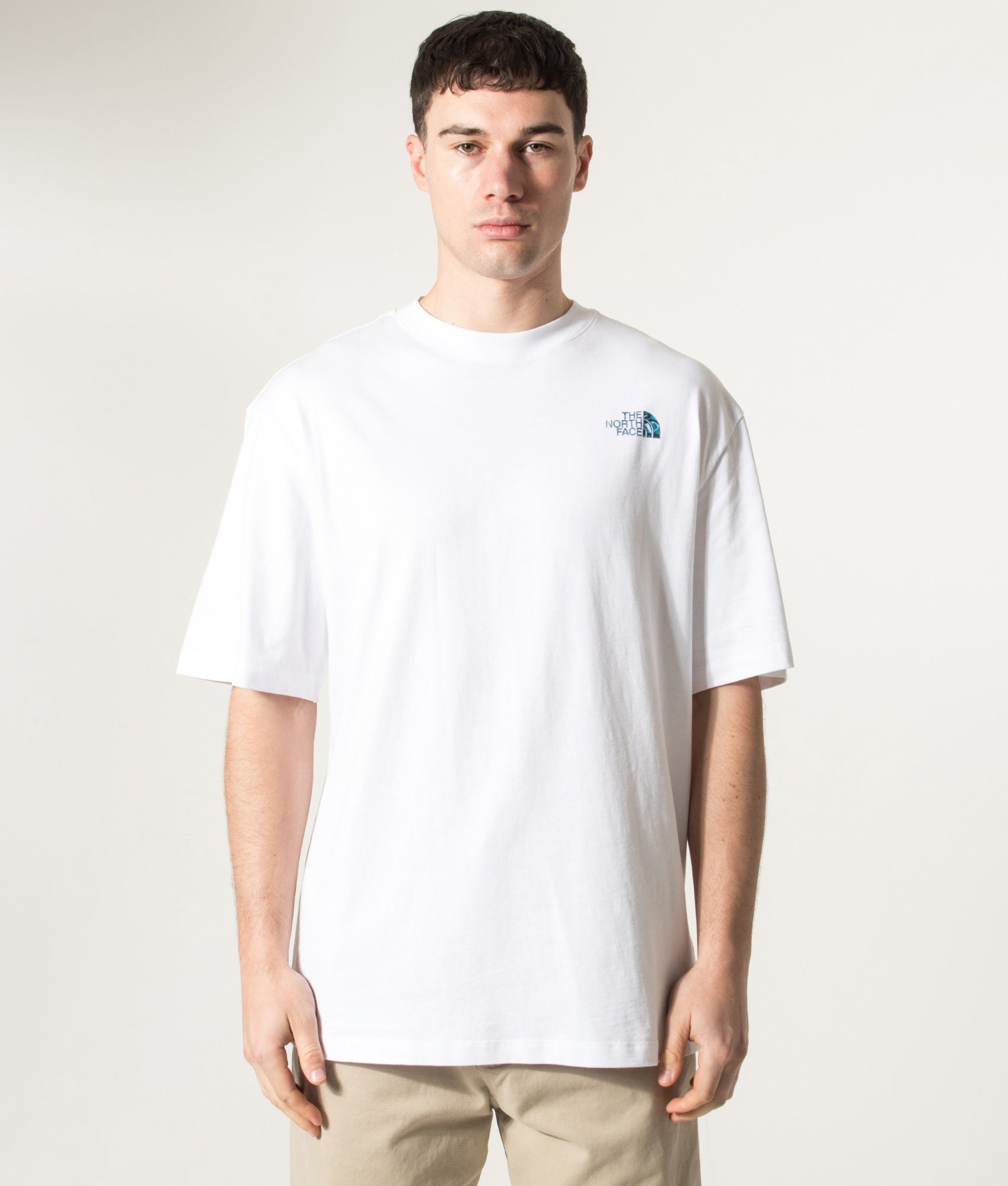 The North Face Oversized Liquid NSE Box Graphic T-Shirt in TNF White at EQVVS Menswear. Model front shot.