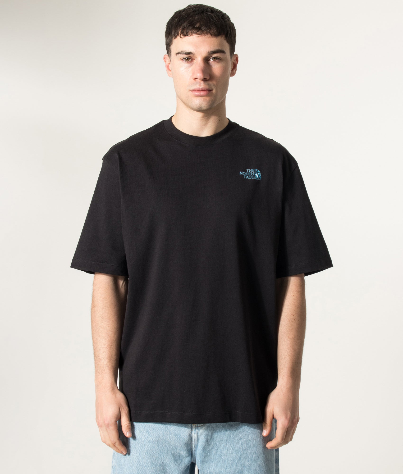 The North Face Oversized Liquid NSE Box Graphic T-Shirt in TNF Black at EQVVS Menswear. Model front shot.